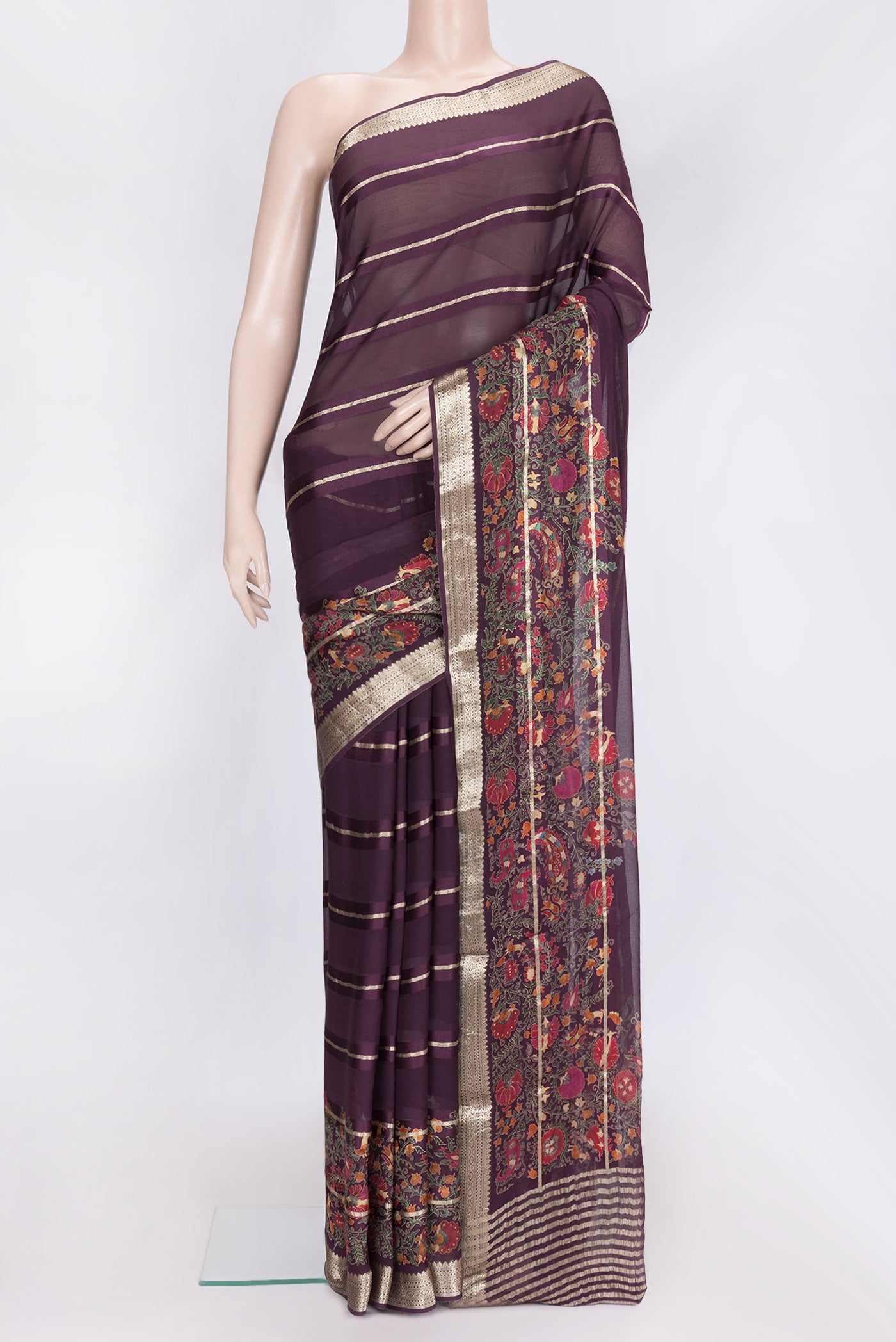 Burgundy Dual Tone Georgette Saree with Stripes on the body and Printed Border.  displayed on a mannequin