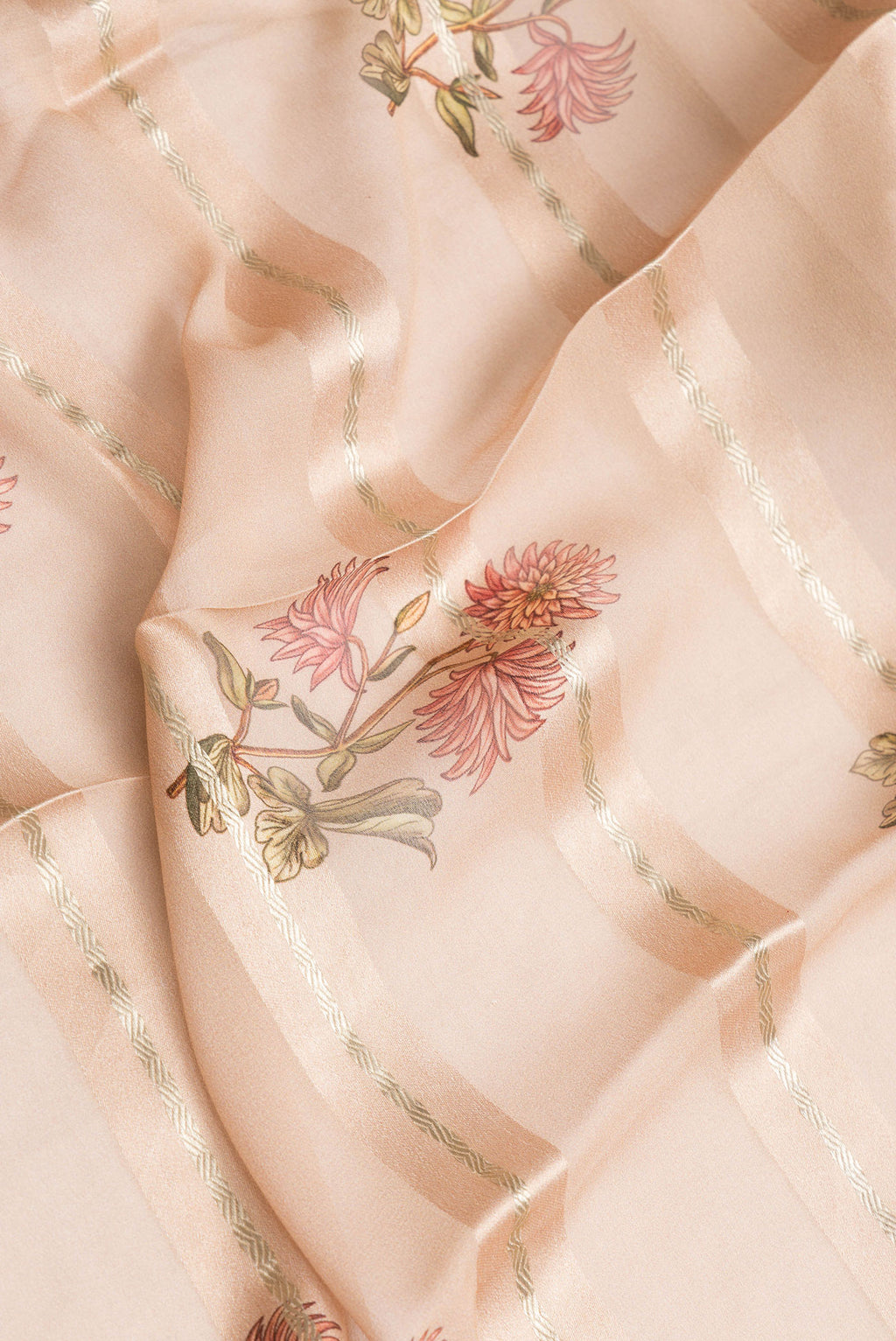 Close up of Peach Dual Tone Mysore Georgette Saree with Stripes on the body and Zari Border.  displaying folds