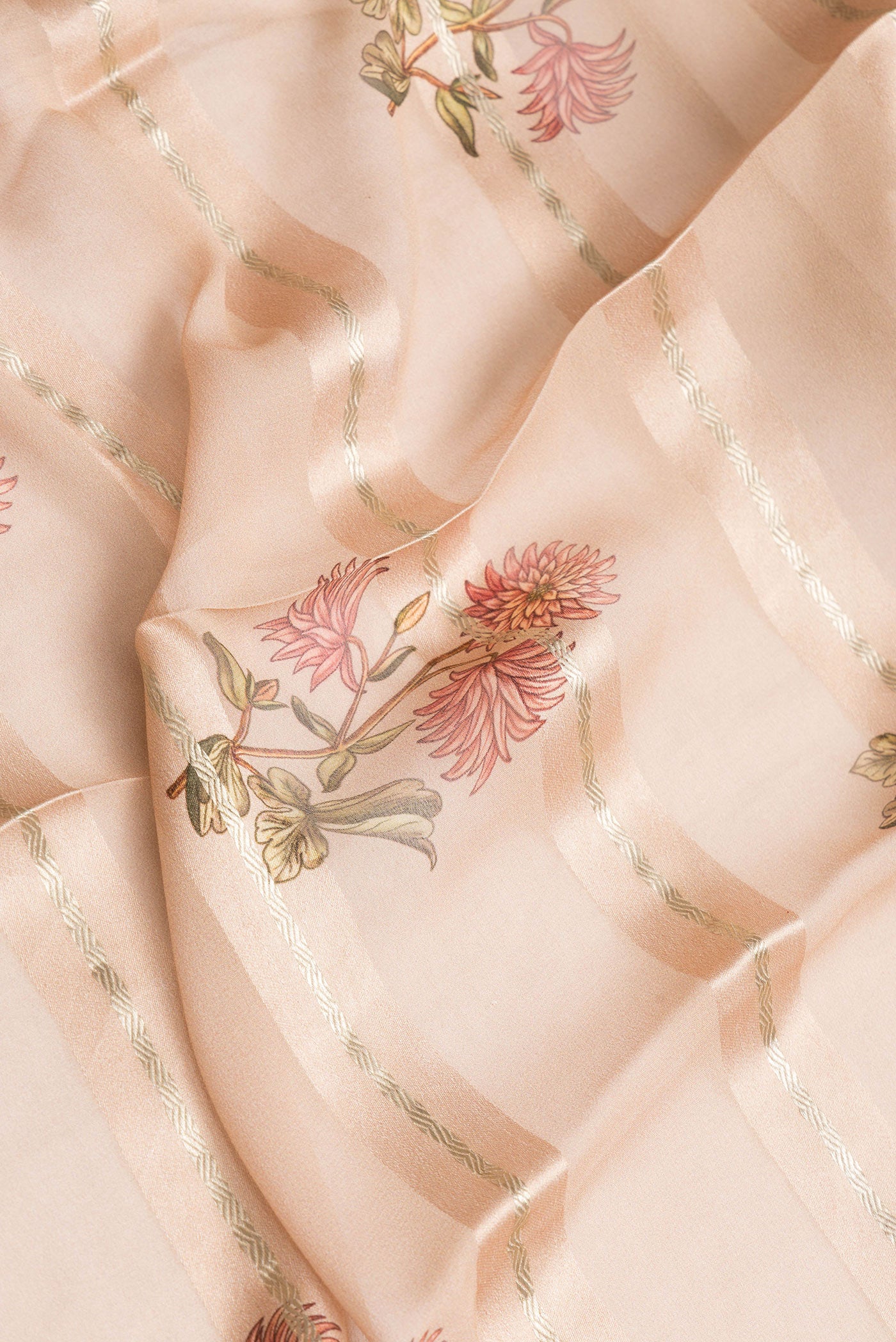 Close up of Peach Dual Tone Mysore Georgette Saree with Stripes on the body and Zari Border.  displaying folds