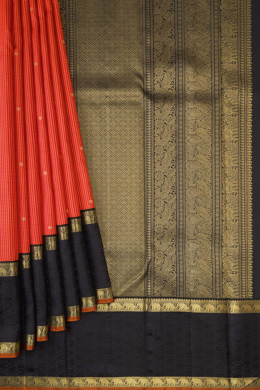 Pleats and pallu of Pure Silk Pure Zari Orange Dual Tone Kanchipuram Saree with Checked design on the body and Zari Border. 