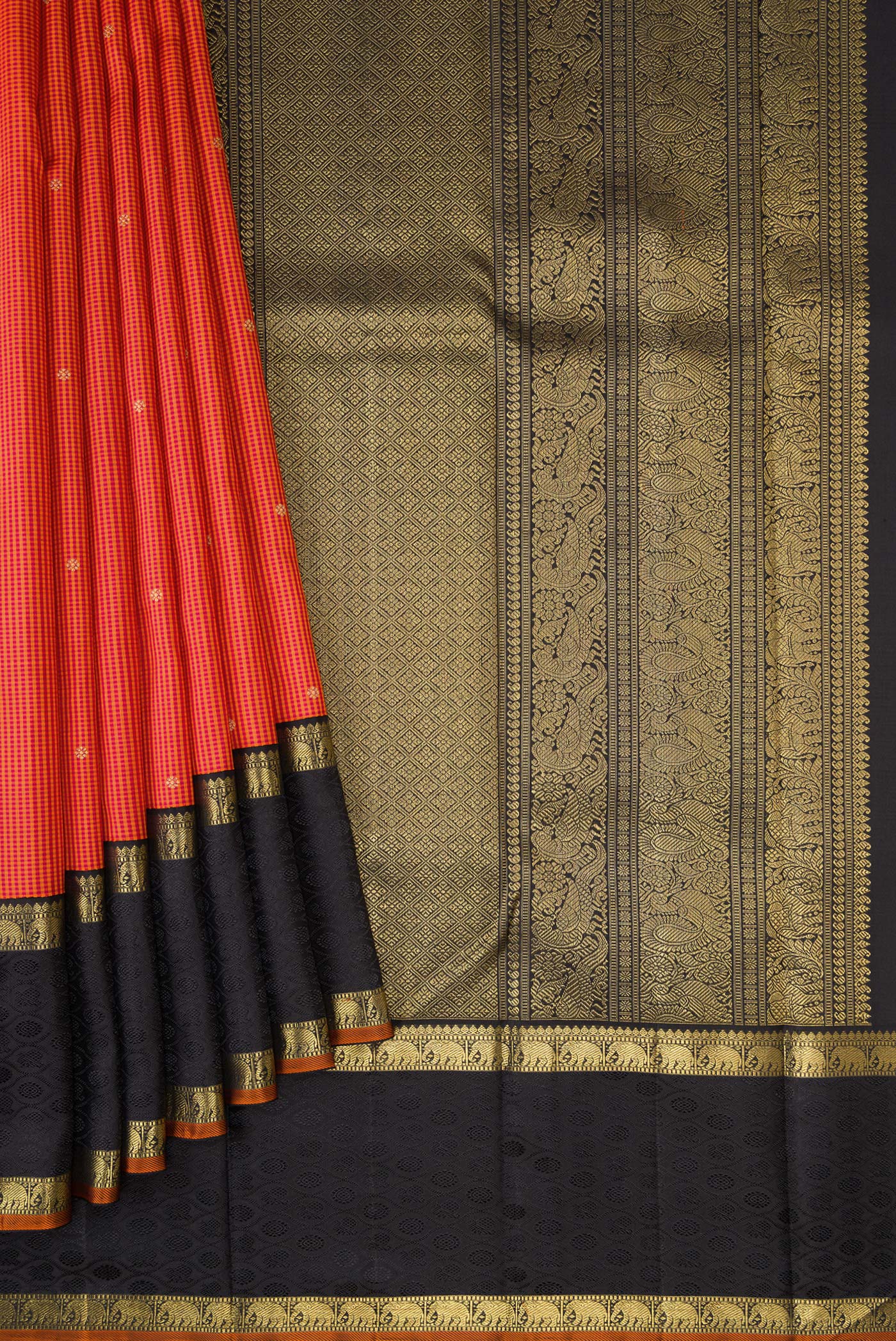 Pleats and pallu of Pure Silk Pure Zari Orange Dual Tone Kanchipuram Saree with Checked design on the body and Zari Border. 