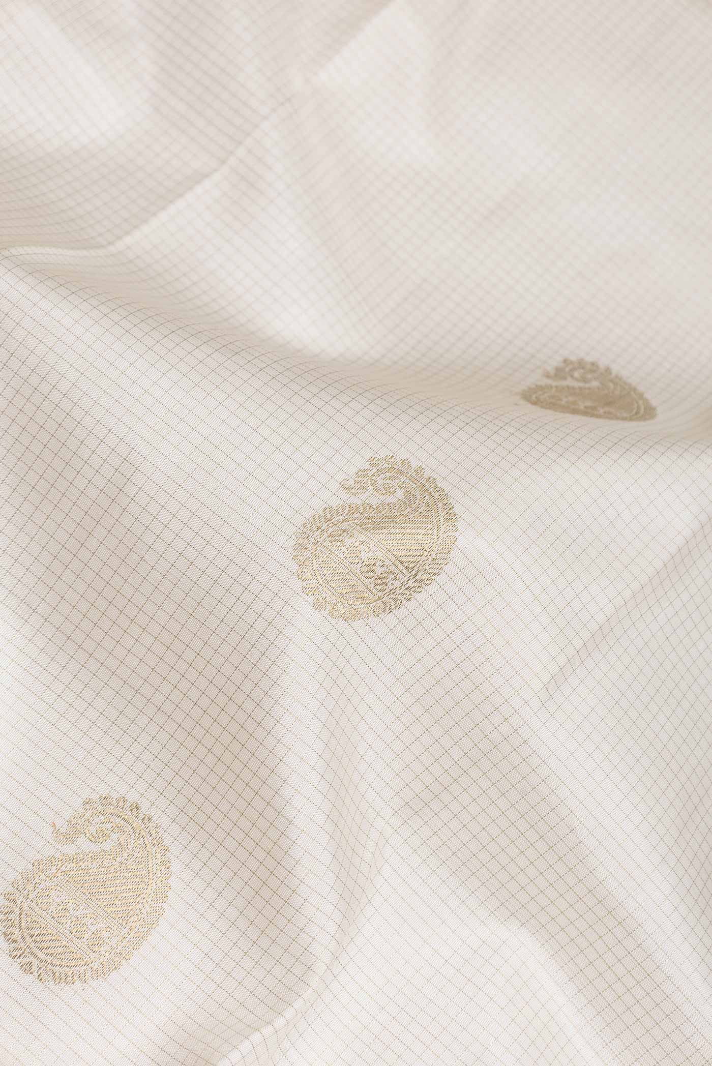 Close up of Pure Silk Pure Zari White Dual Tone Kanchipuram Saree with Checked design on the body and Zari Border displaying folds