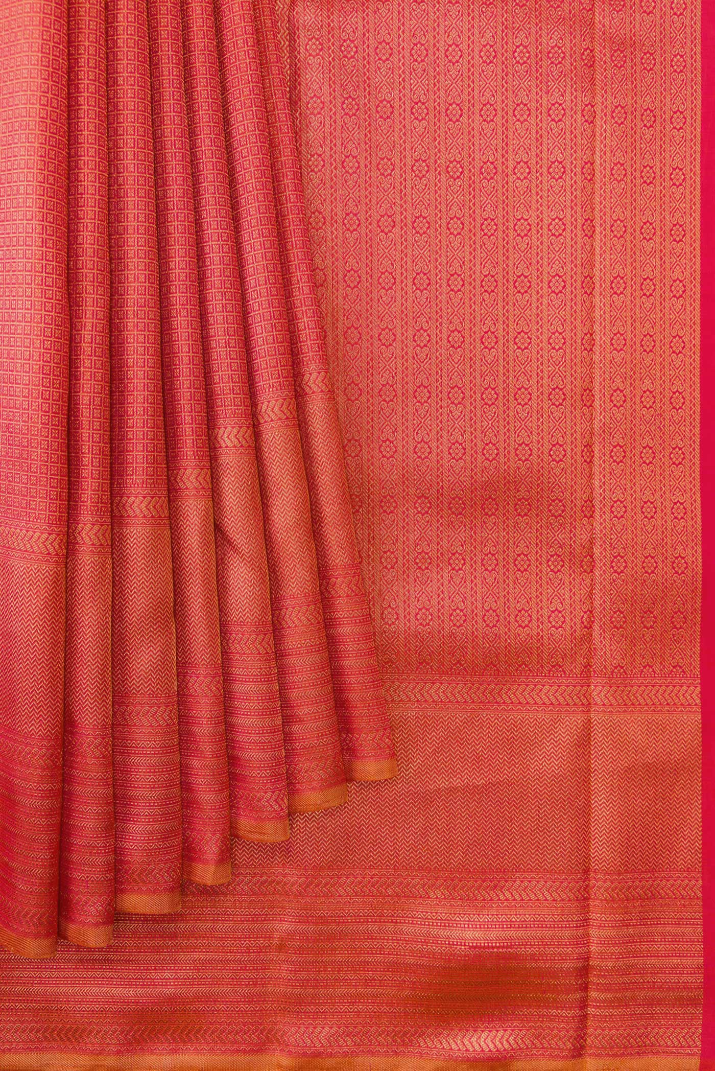 Pleats and pallu of Brick Orange Dual Tone Kanjivaram Silk Saree with Zari Brocade on the body and Fancy Border. 