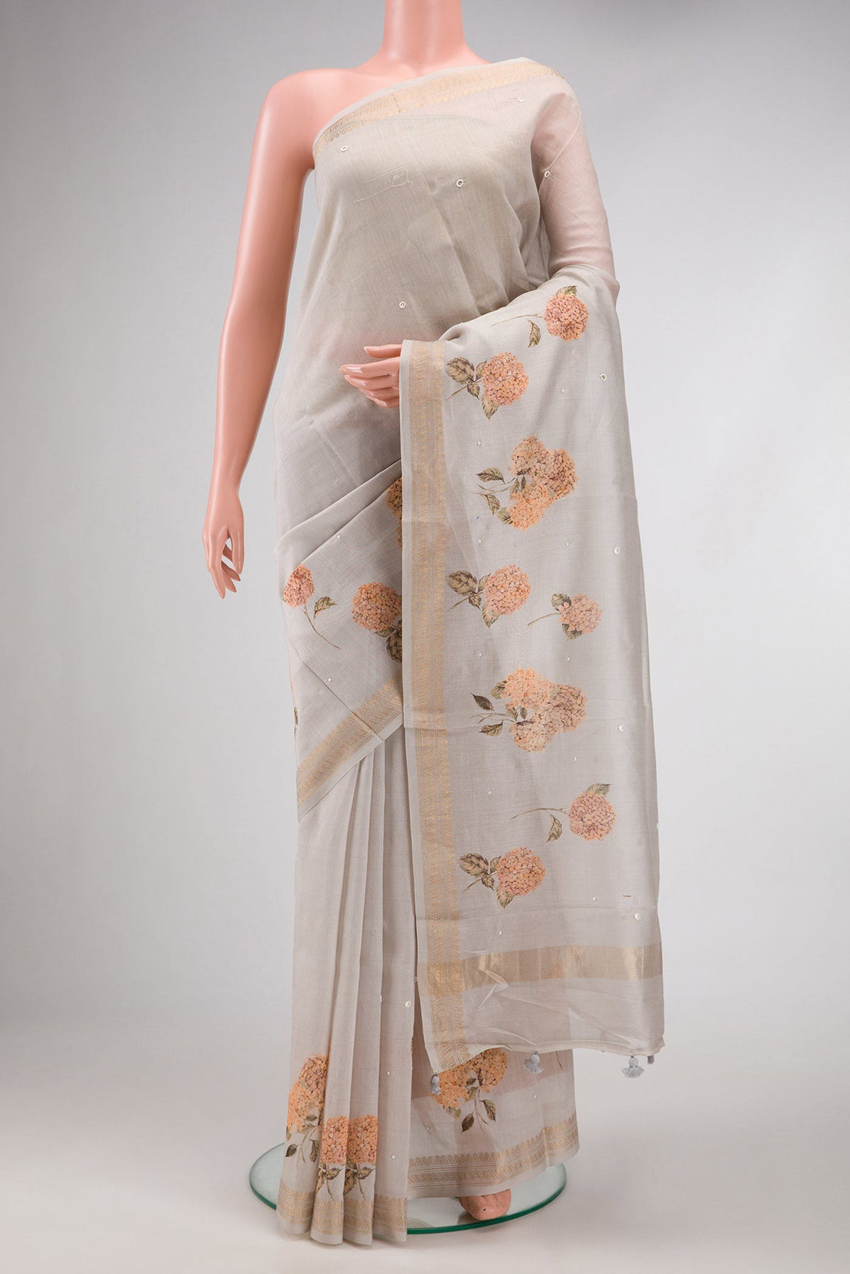 Grey Dual Tone Tussar Silk Saree with Printed design on the body and Zari Border.  displayed on a mannequin