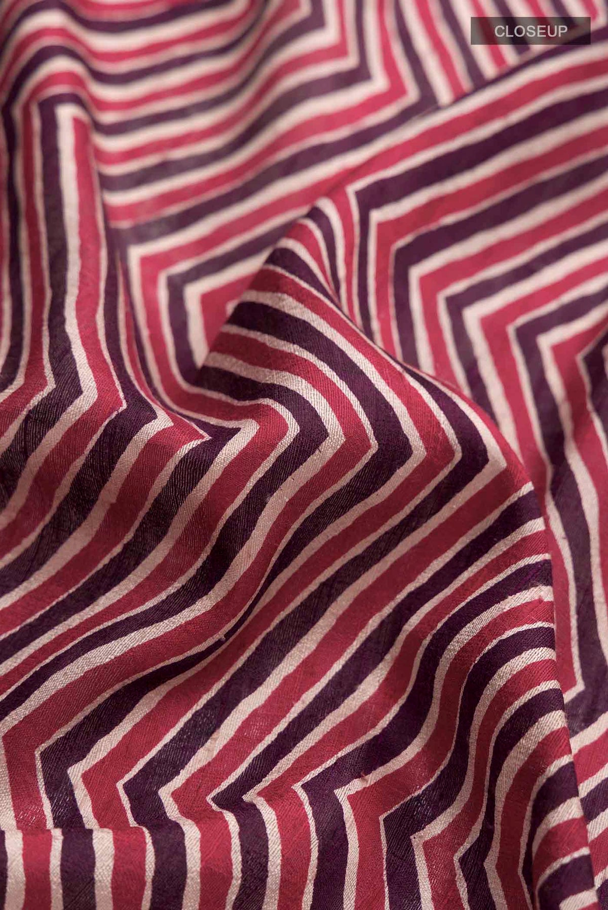 Close up of Multi Color Tussar Silk Saree with Stripes on the body and Thread Border displaying folds