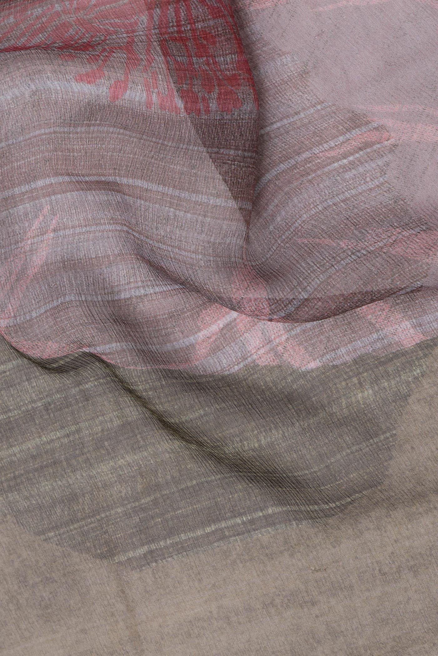 Close up of Mehandi Green Chiffon Saree with Printed design on the body and Zari Border.  displaying folds
