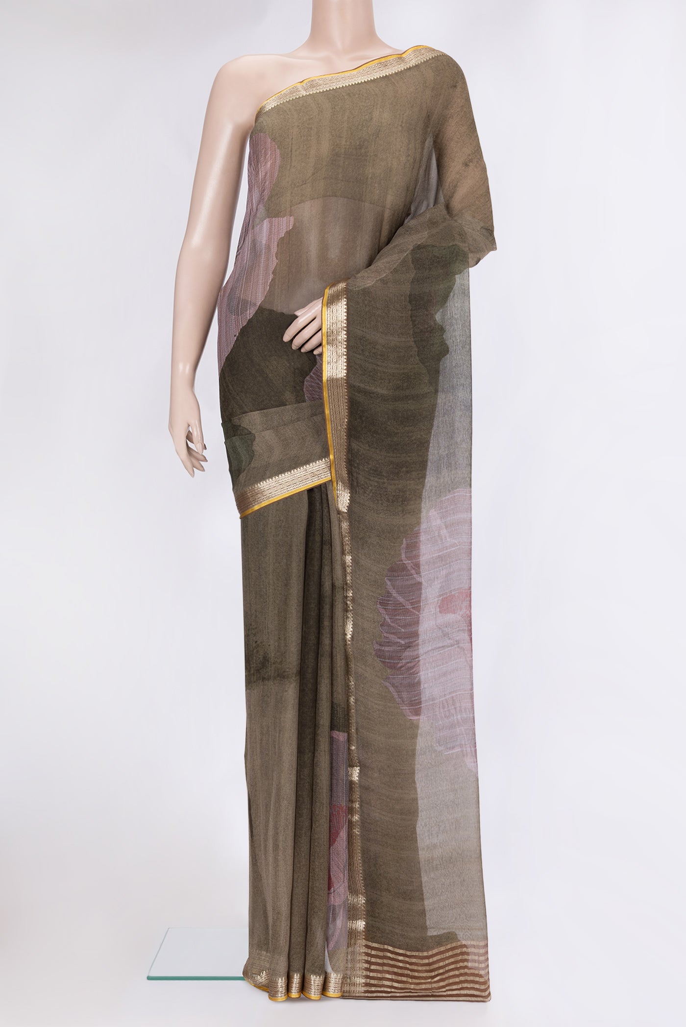 Mehandi Green Chiffon Saree with Printed design on the body and Zari Border.  displayed on a mannequin