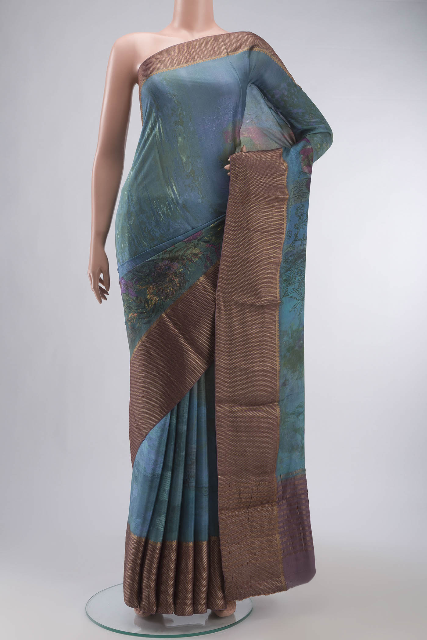 Blue Mysore Crepe Saree with Printed design on the body and Zari Border displayed on a mannequin