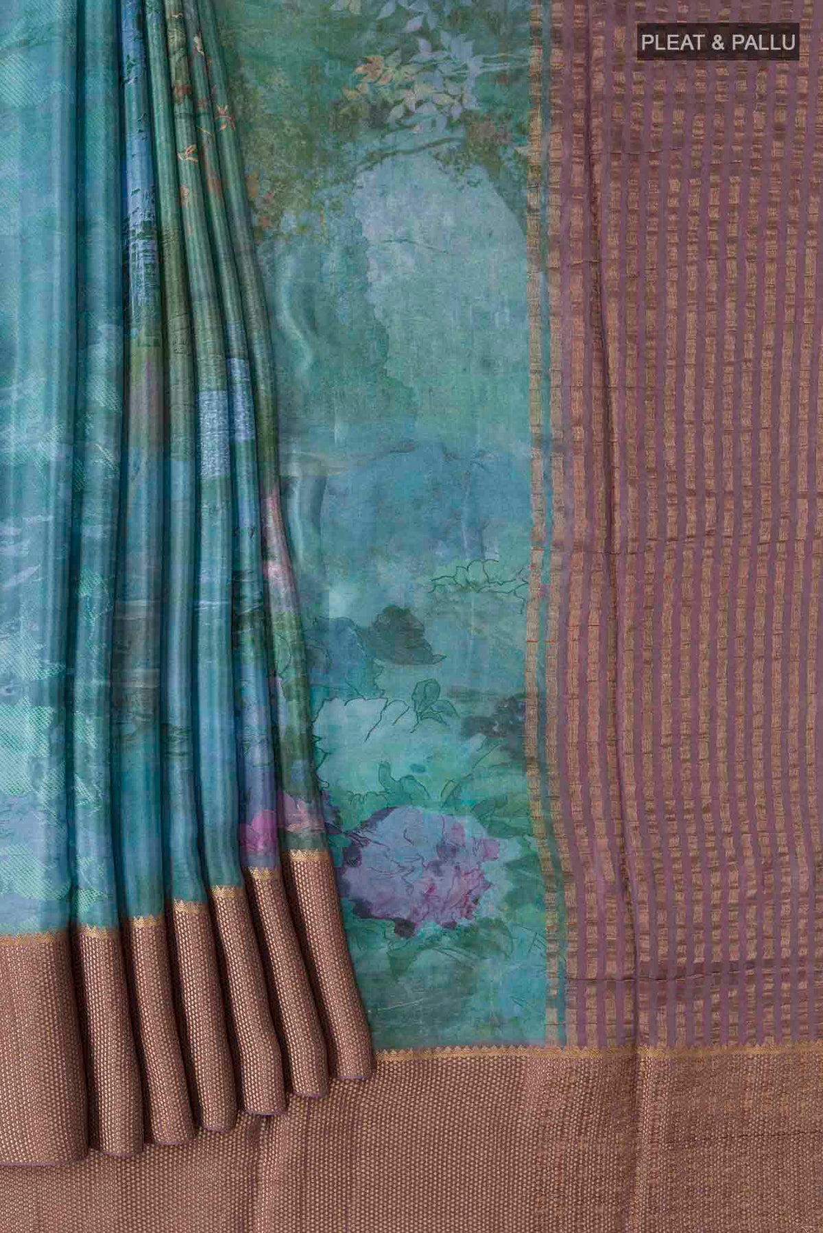 Pleats and pallu of Blue Mysore Crepe Saree with Printed design on the body and Zari Border