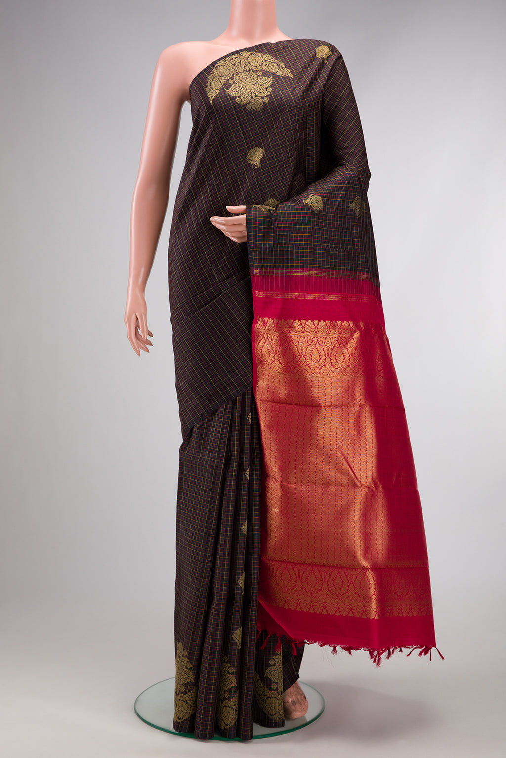 Brown Dual Tone Kanchipuram Silk Saree with Checked design on the body and Fancy Border.  displayed on a mannequin