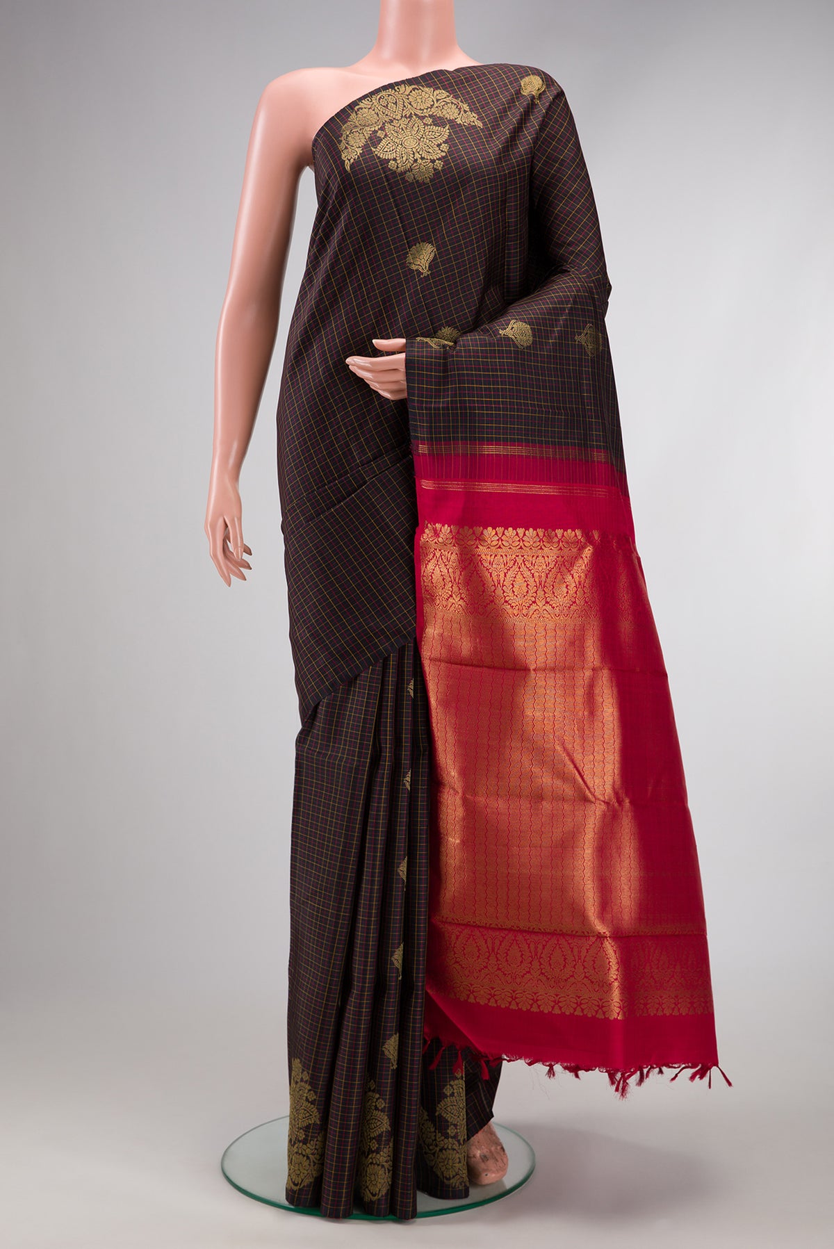 Brown Dual Tone Kanchipuram Silk Saree with Checked design on the body and Fancy Border.  displayed on a mannequin
