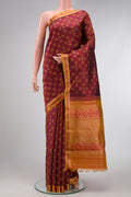 Maroon Dual Tone Kanchipuram Silk Saree with Jacquard design on the body and Zari Border.  displayed on a mannequin