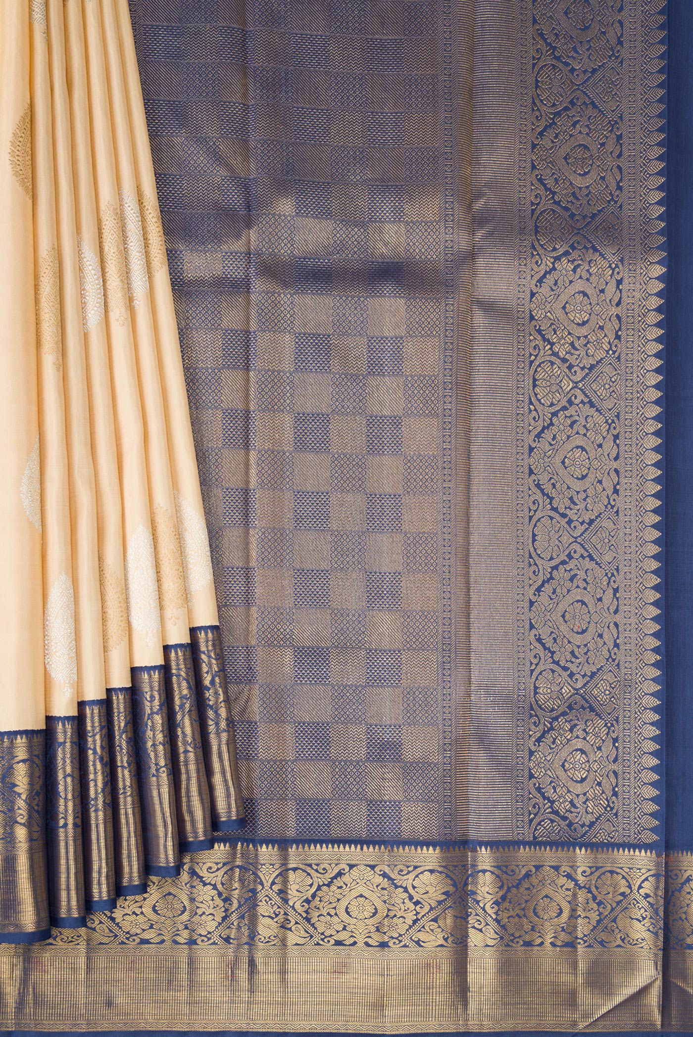 Pleats and pallu of Pure Silk Pure Zari Beige Kanchipuram Saree with Zari Butta on the body and Zari Border. 