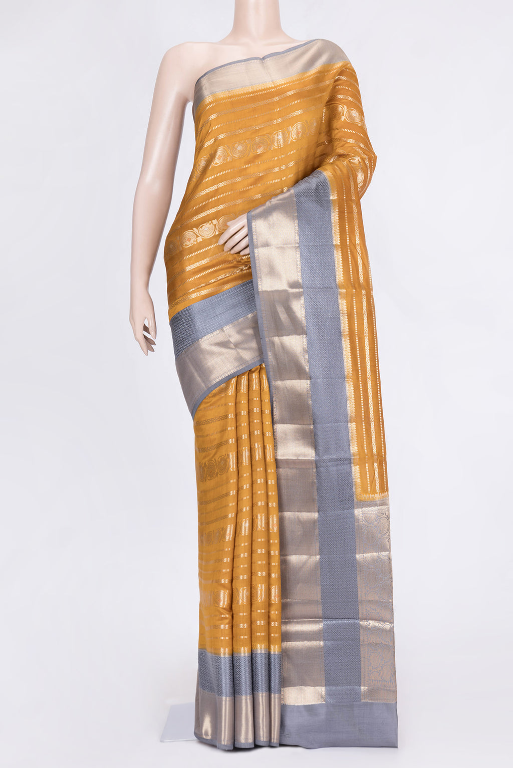 Mustard Dual Tone Tussar Silk Saree with Stripes on the body and Zari Border.  displayed on a mannequin