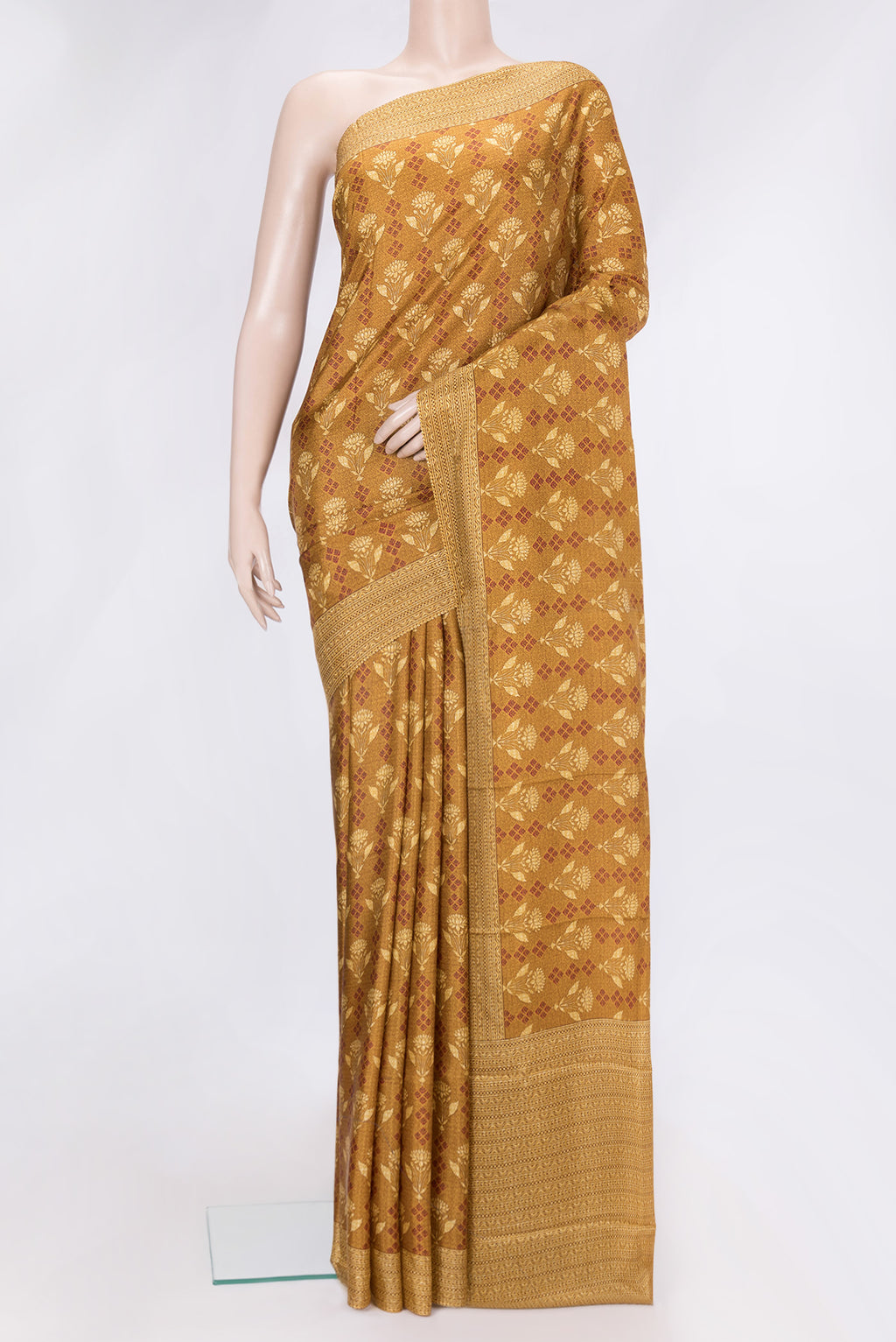 Mustard Dual Tone Printed Silk Saree with Printed design on the body and Printed Border.  displayed on a mannequin