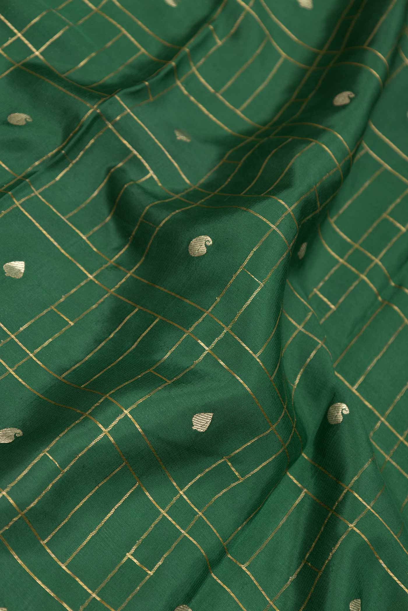 Close up of Green Dual Tone Mysore Crepe Saree with Checked design on the body and Zari Border displaying folds