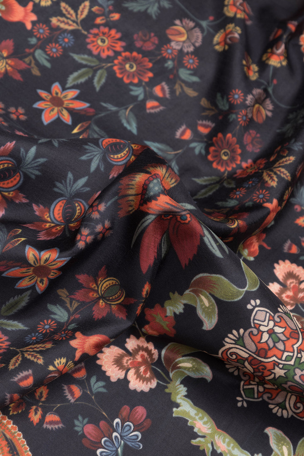 Close up of Black Dual Tone Kanjivaram Silk Saree with Printed design on the body and Zari Border.  displaying folds