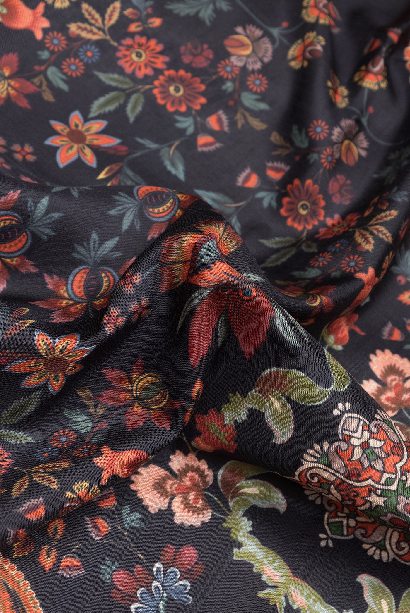 Close up of Black Dual Tone Kanjivaram Silk Saree with Printed design on the body and Zari Border.  displaying folds