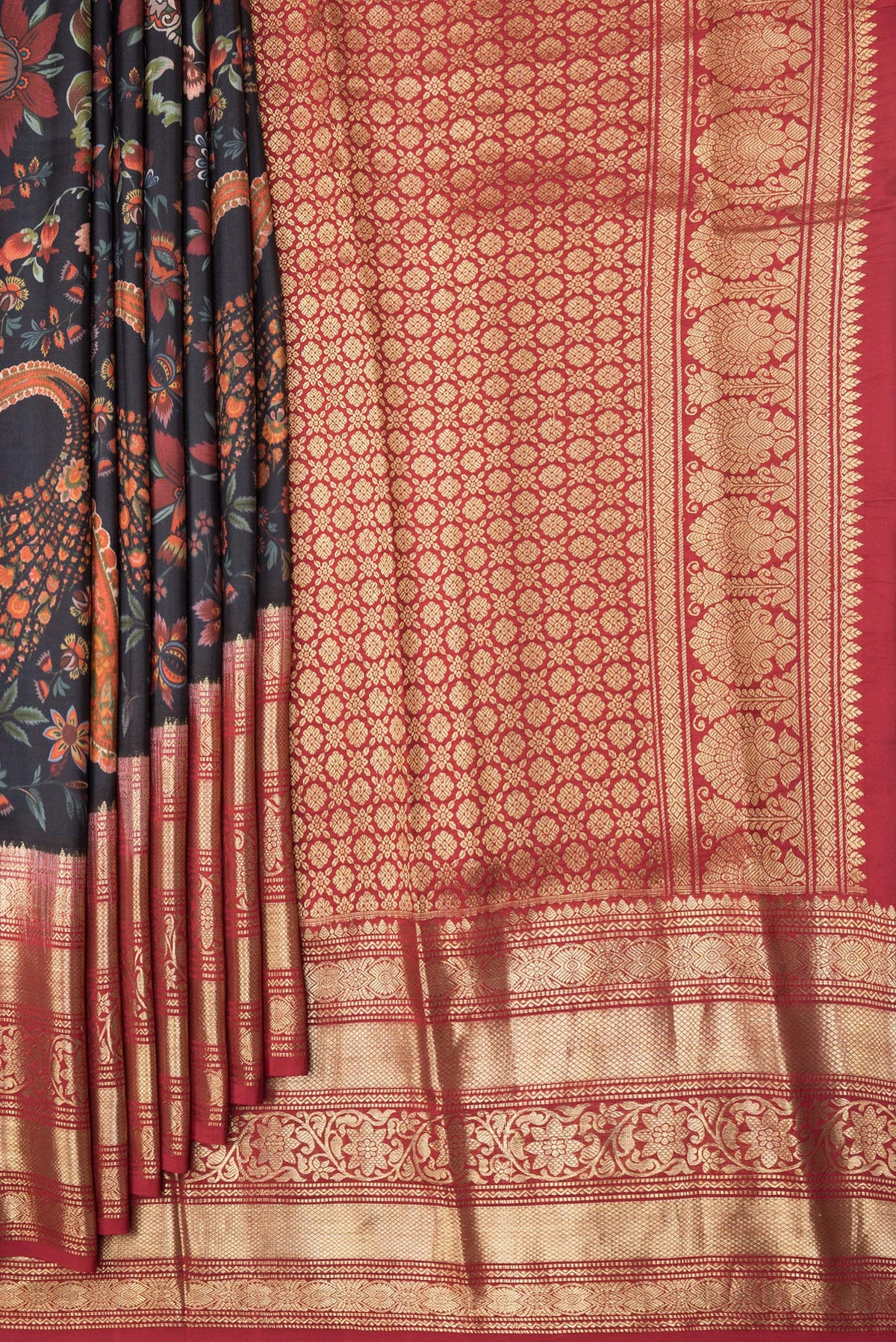 Pleats and pallu of Black Dual Tone Kanjivaram Silk Saree with Printed design on the body and Zari Border. 