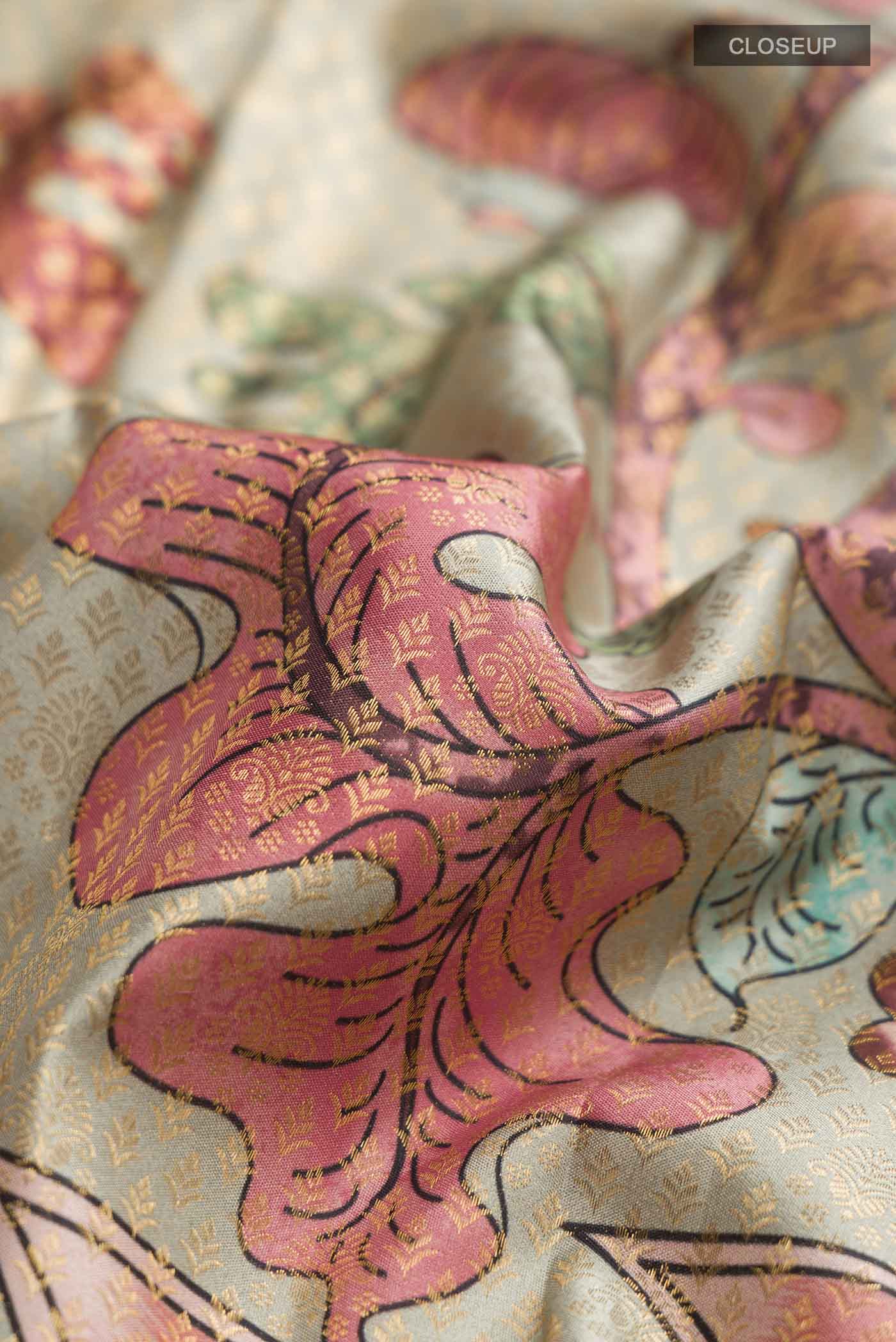 Close up of Multi Color Kanchipuram Silk Saree with Printed design on the body and Zari Border displaying folds
