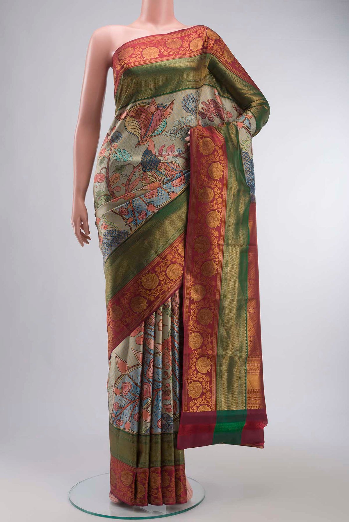 Multi Color Kanchipuram Silk Saree with Printed design on the body and Zari Border displayed on a mannequin