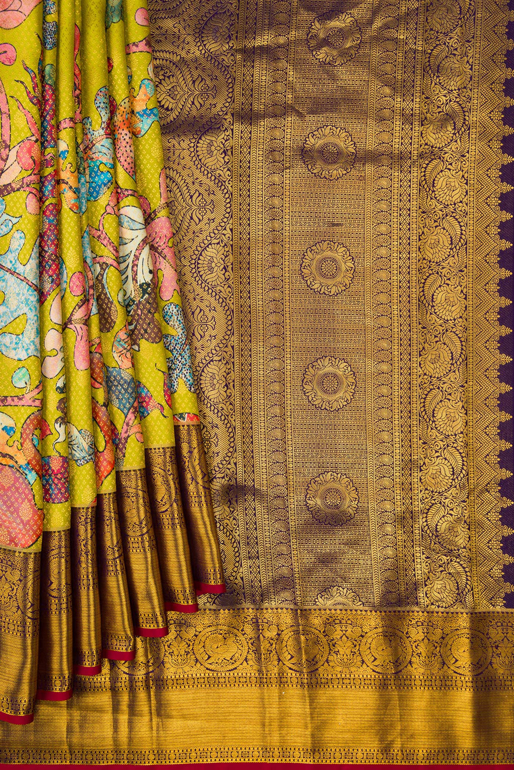 Pleats and pallu of Green Kanjivaram Silk Saree with Printed design on the body and Zari Border. 
