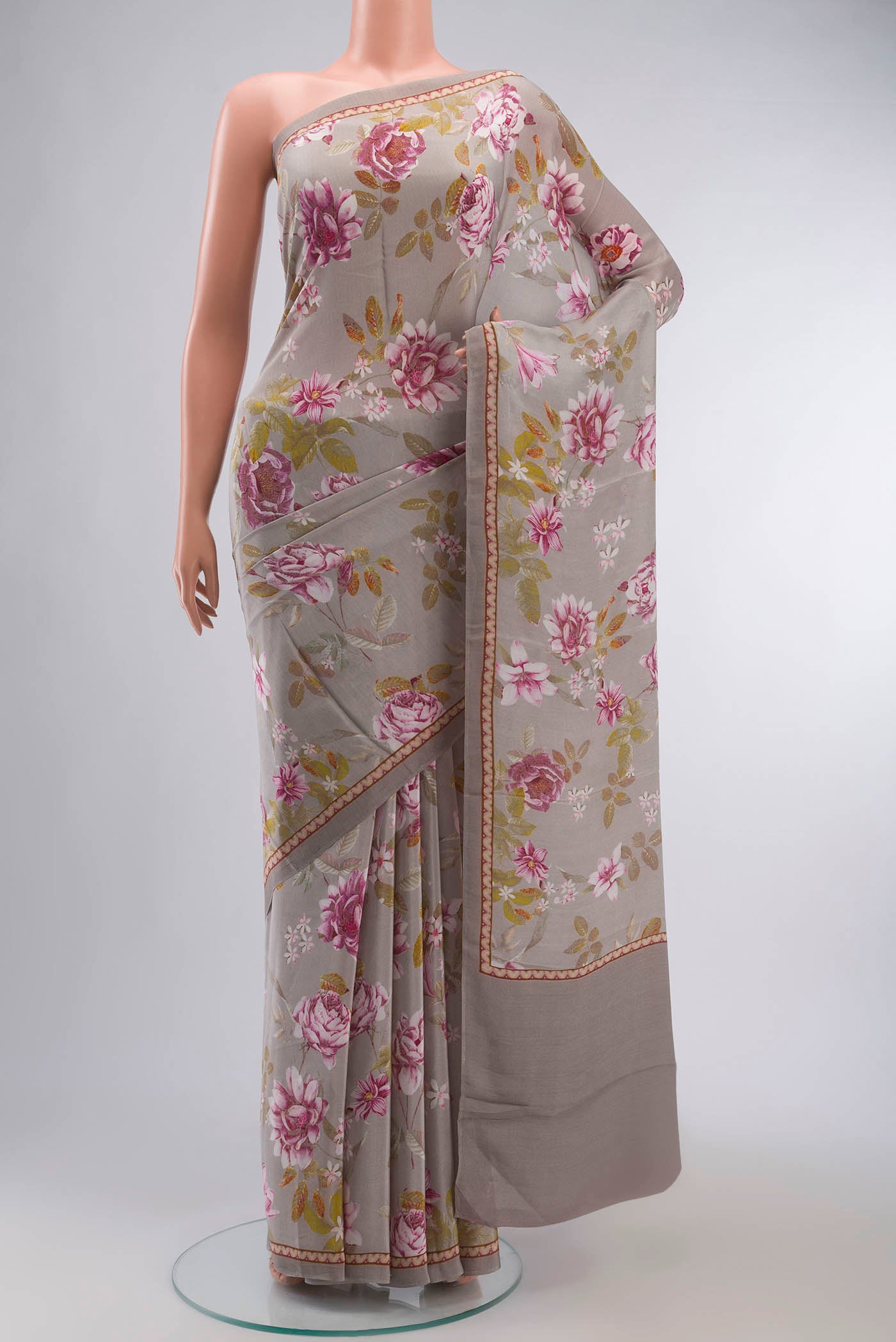 Grey Mysore Crepe Saree with Floral Print on the body and Printed Border displayed on a mannequin