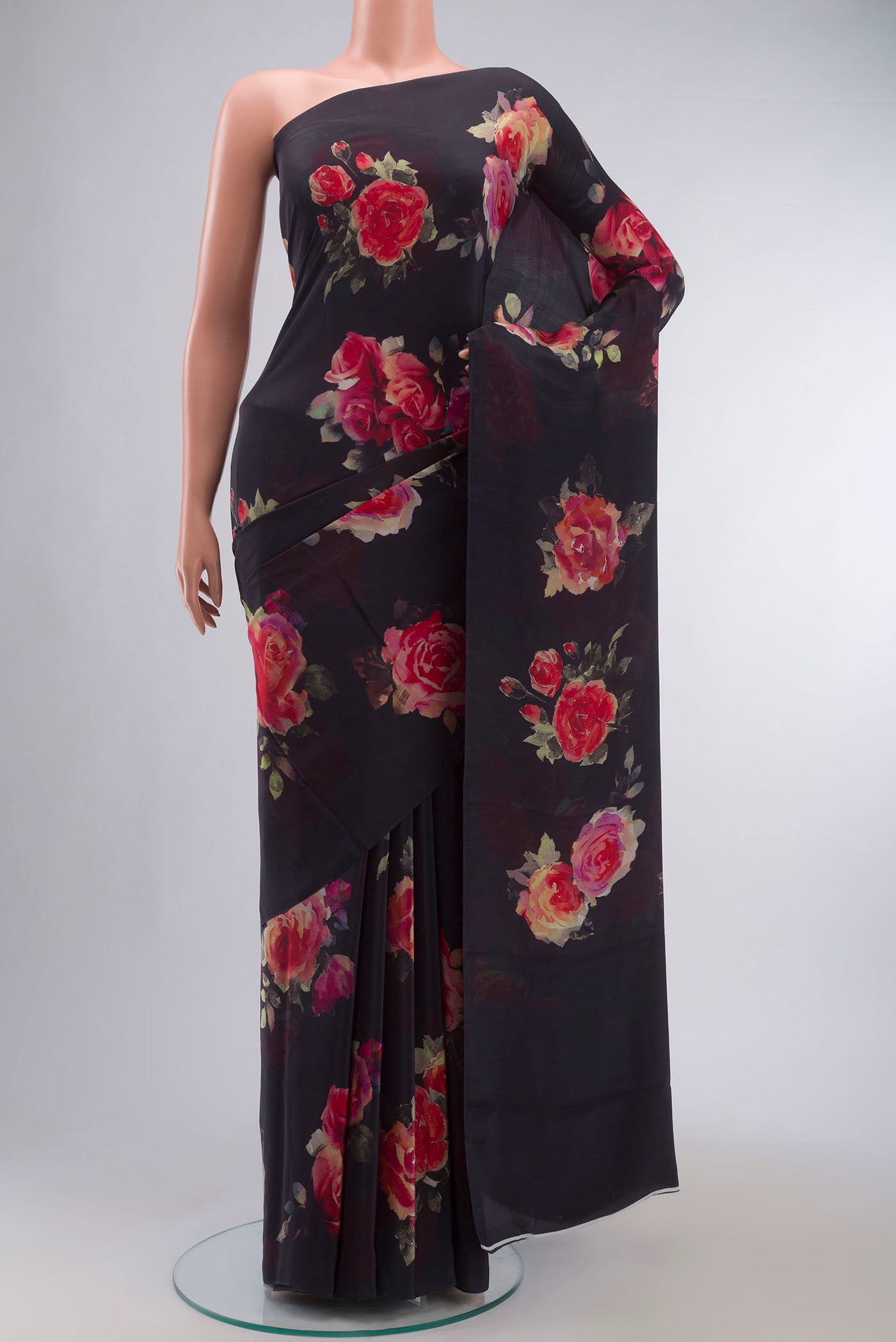 Black Mysore Crepe Saree with Floral Print on the body and Without Border displayed on a mannequin