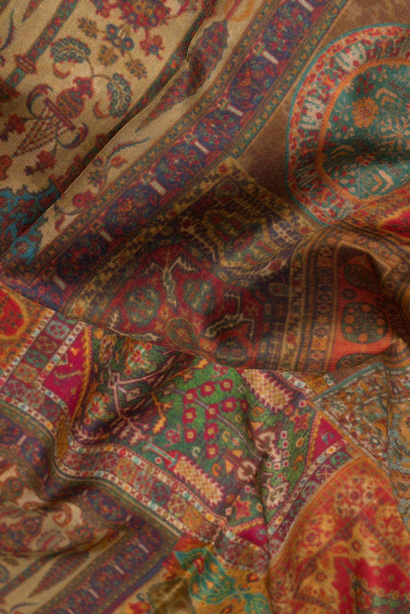 Close up of Mustard Dual Tone Kanchipuram Silk Saree with Printed design on the body and Zari Border.  displaying folds