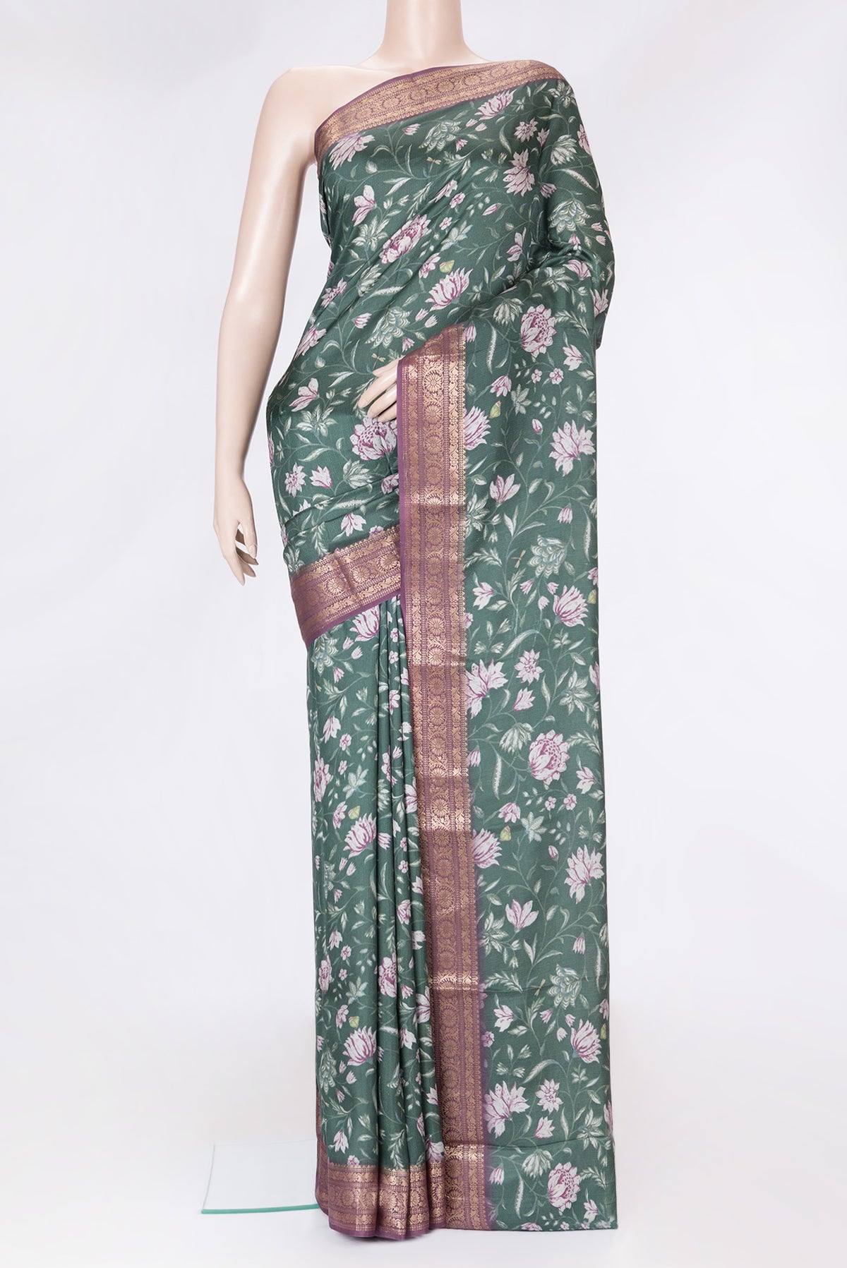 Green Dual Tone Tussar Silk Saree with Printed design on the body and Zari Border.  displayed on a mannequin