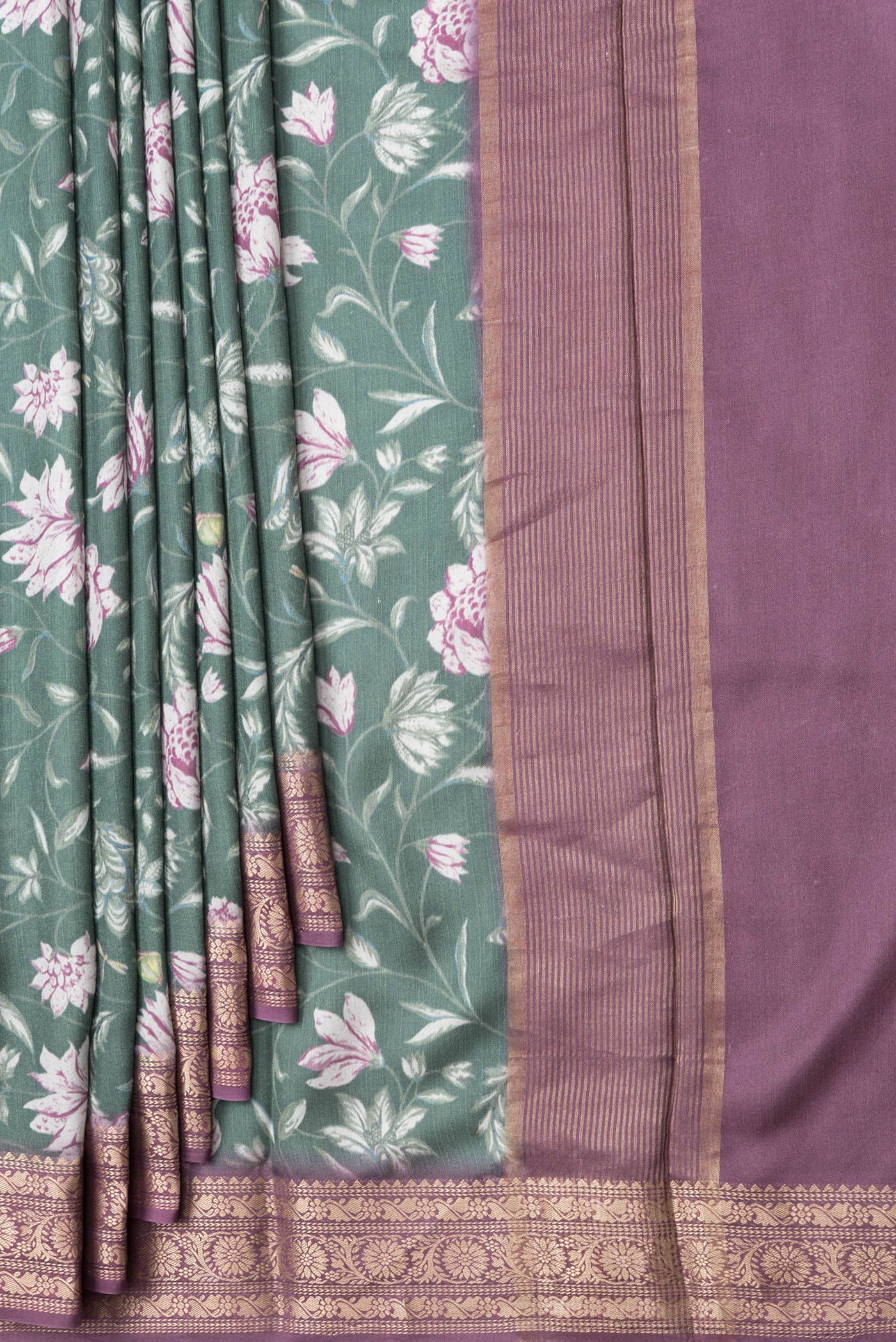 Pleats and pallu of Green Dual Tone Tussar Silk Saree with Printed design on the body and Zari Border. 