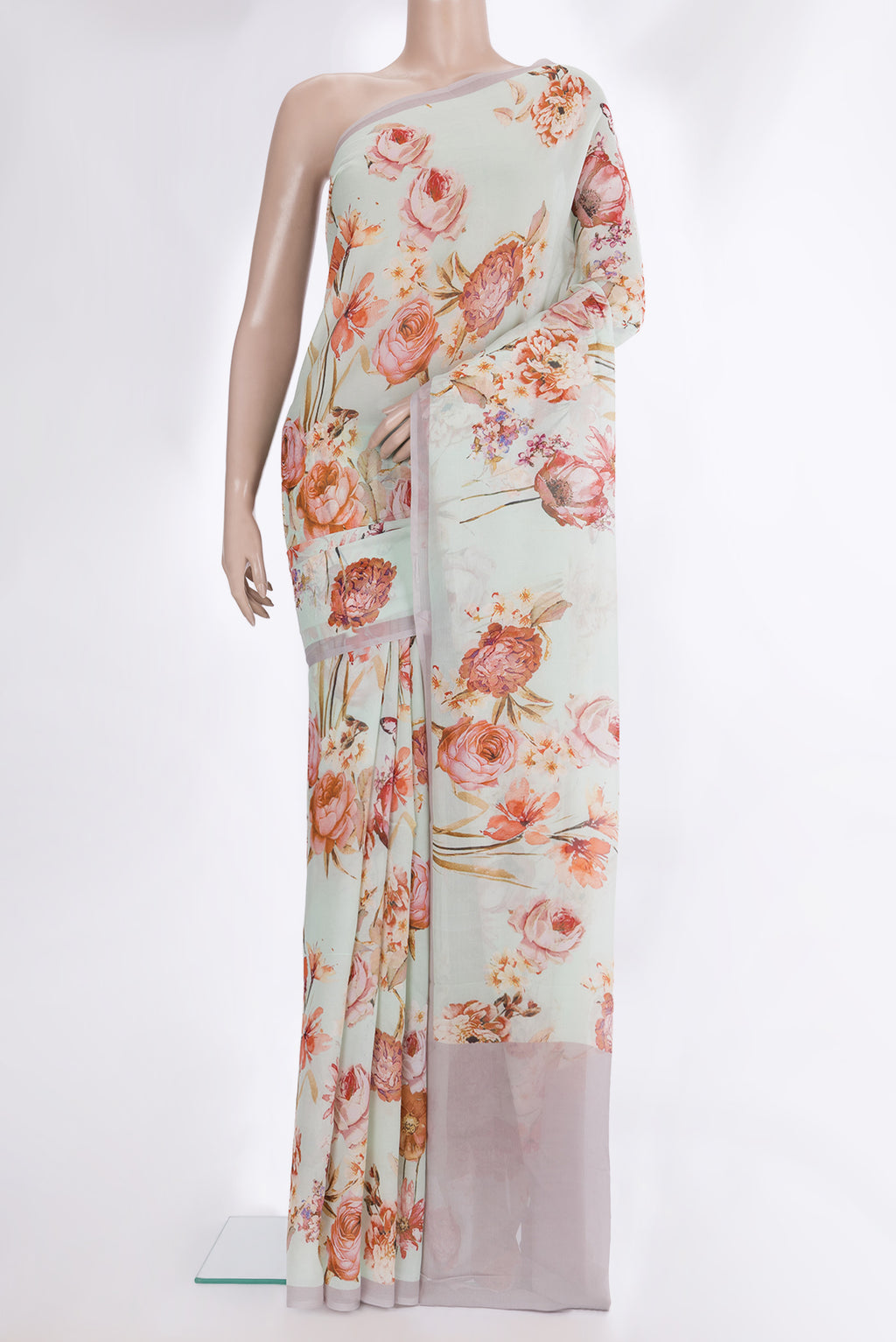 Pista Green Mysore Chiffon Saree with Floral Print on the body and Plain Border.  displayed on a mannequin