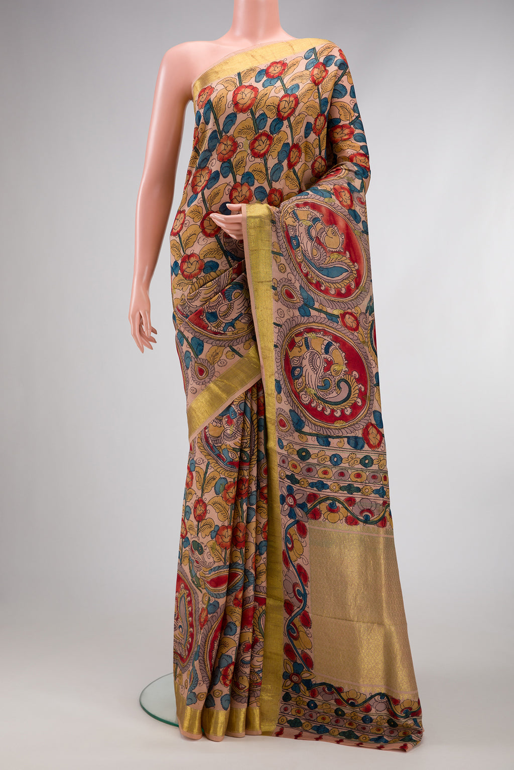 Golden Peach Dual Tone Kanchipuram Silk Saree with kalamkari Print on the body and Zari Border.  displayed on a mannequin