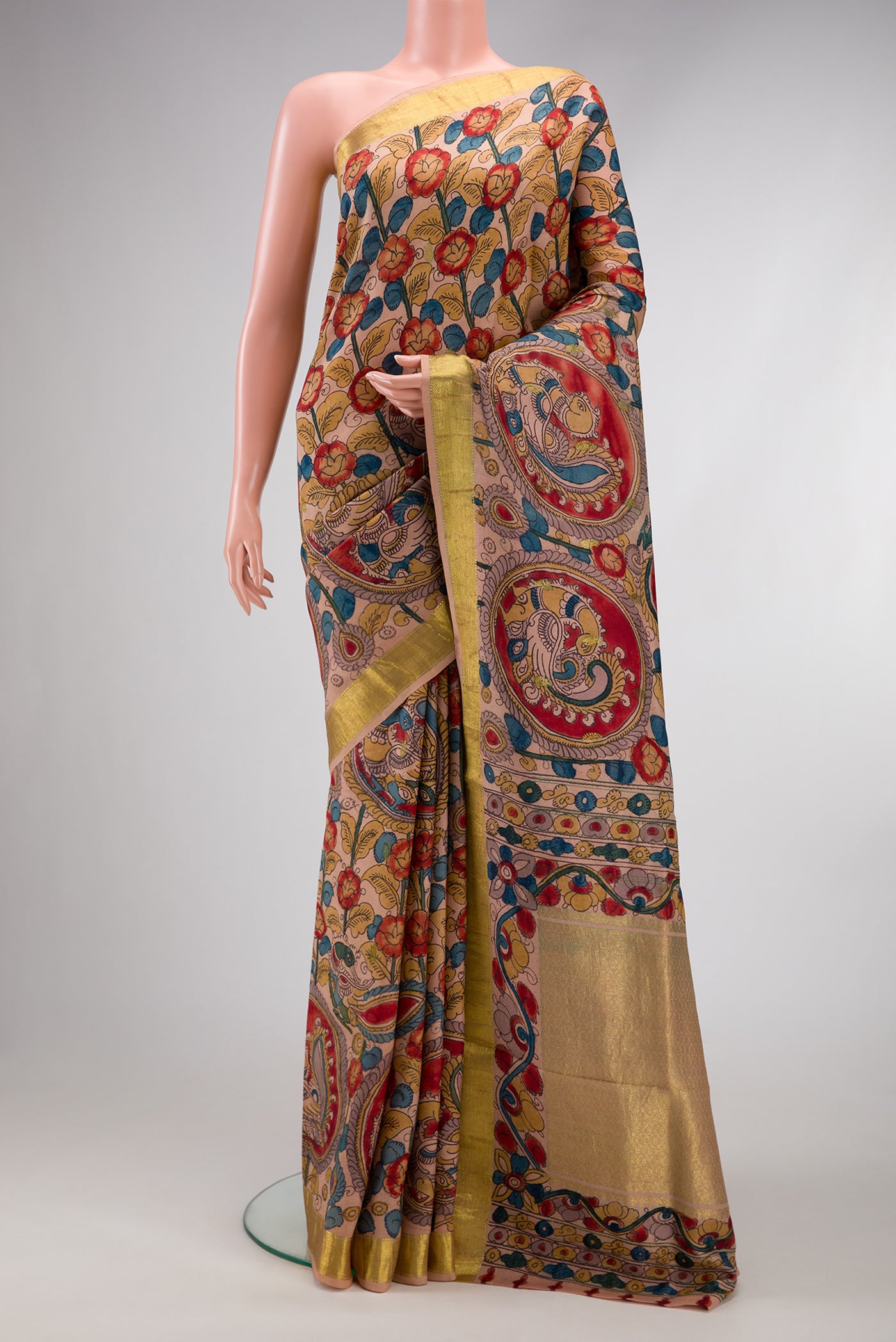 Golden Peach Dual Tone Kanchipuram Silk Saree with kalamkari Print on the body and Zari Border.  displayed on a mannequin