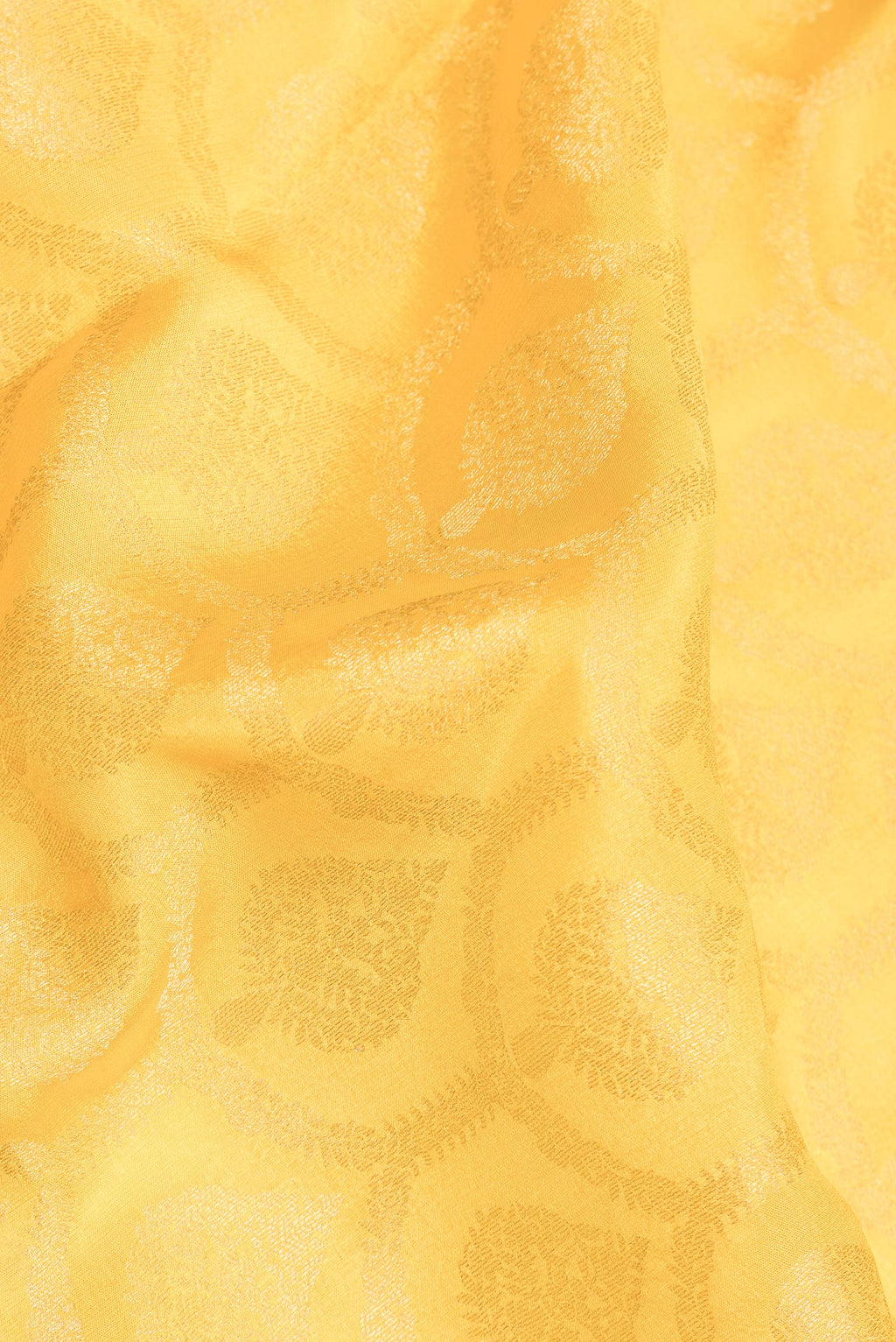 Close up of Yellow Dual Tone Georgette Saree with Zari Brocade on the body and Fancy Border.  displaying folds