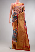 Golden Peach Dual Tone Kanchipuram Silk Saree with kalamkari Print on the body and Zari Border.  displayed on a mannequin