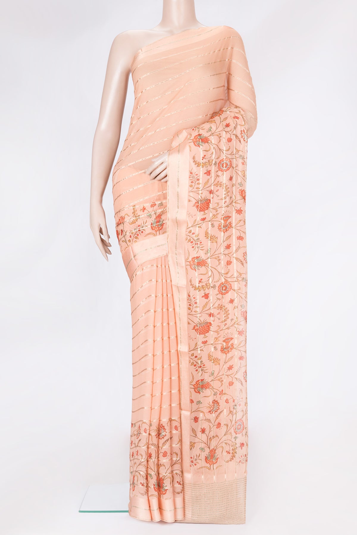 Golden Peach Dual Tone Mysore Georgette Saree with Printed design on the body and Zari Border.  displayed on a mannequin