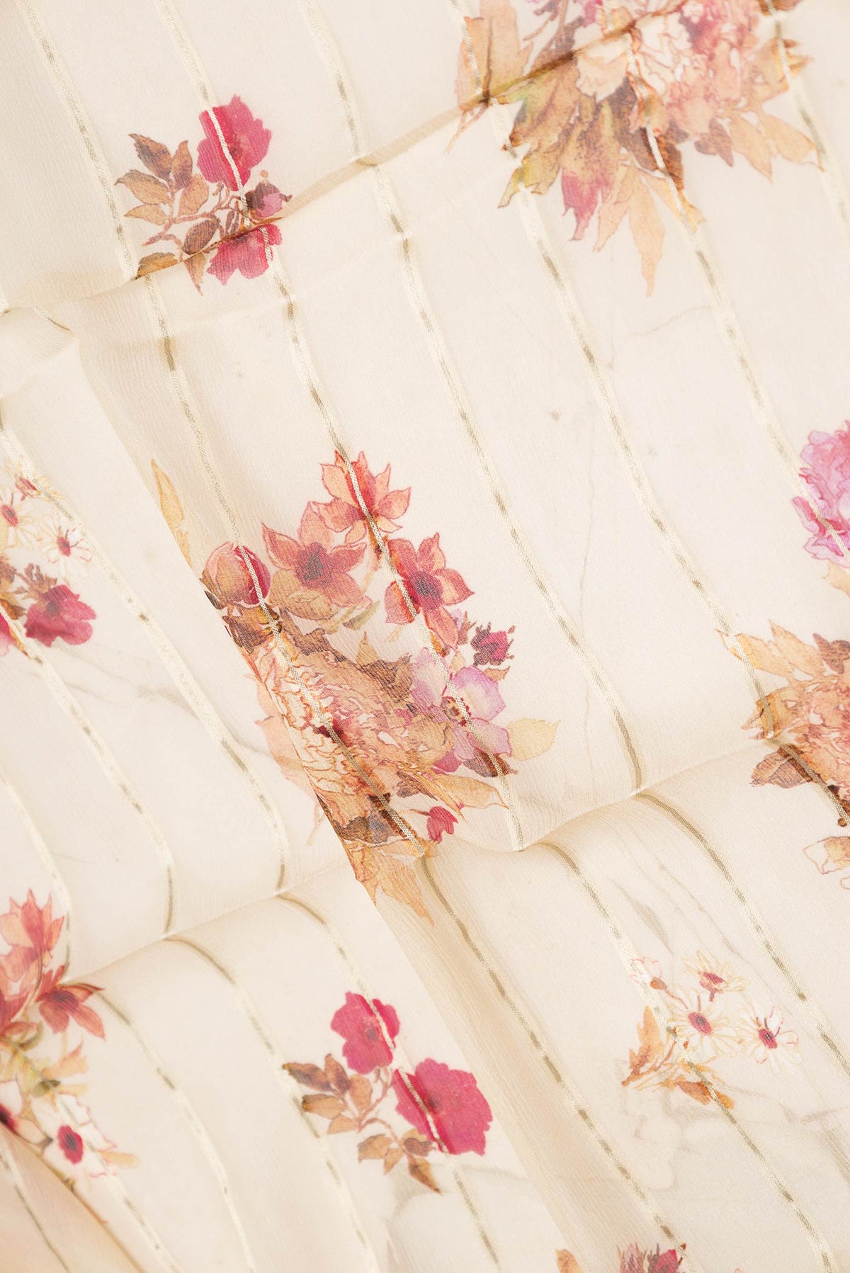 Close up of Beige Dual Tone Mysore Georgette Saree with Stripes on the body and Zari Border displaying folds