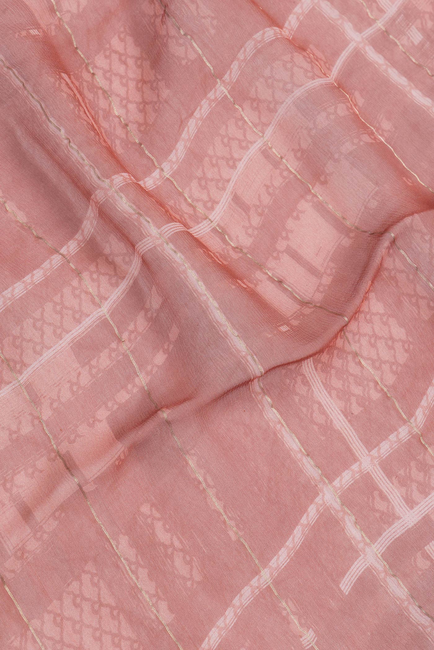Close up of Bronze Dual Tone Mysore Georgette Saree with Printed design on the body and Zari Border.  displaying folds