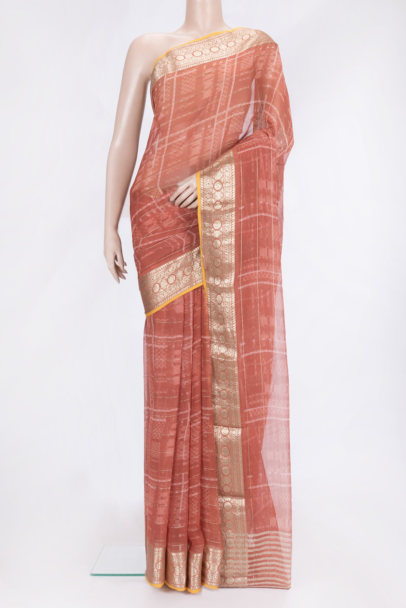 Bronze Dual Tone Mysore Georgette Saree with Printed design on the body and Zari Border.  displayed on a mannequin