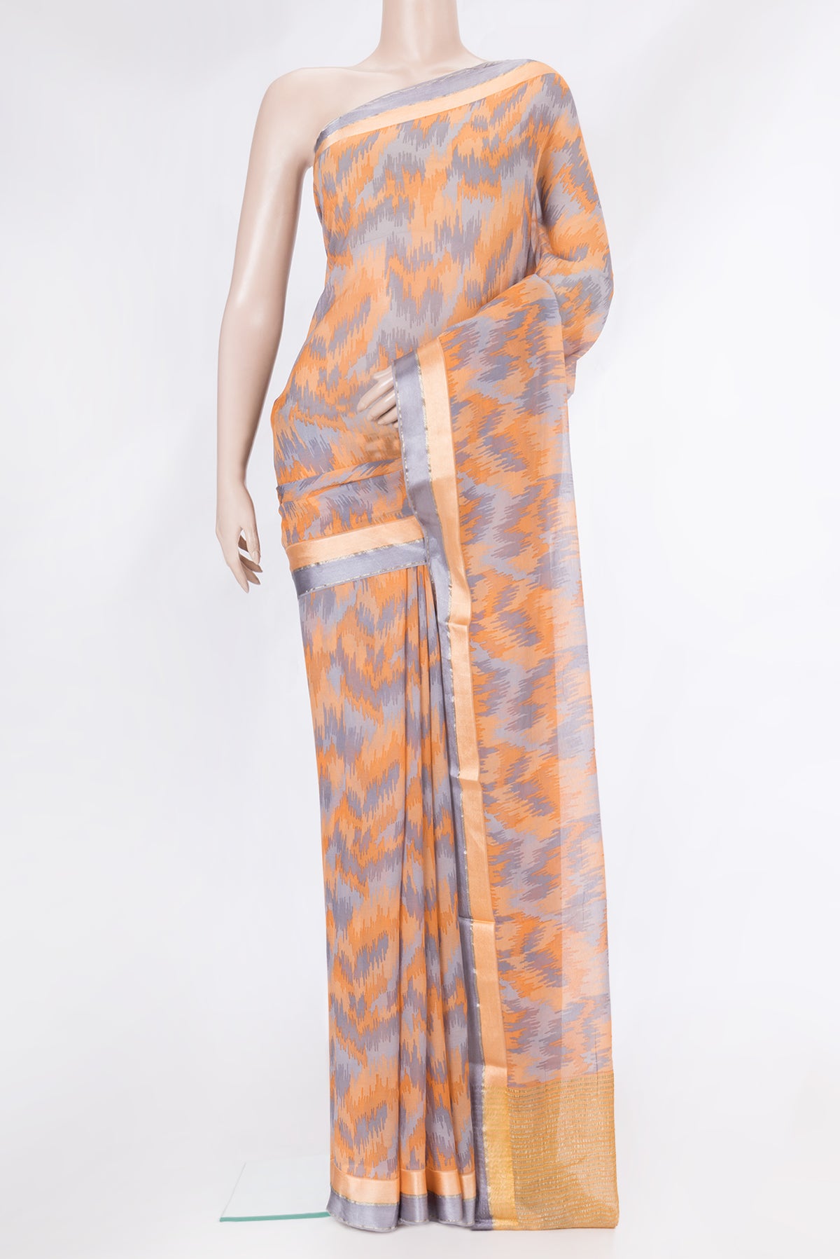 Orange Dual Tone Mysore Chiffon Saree with Printed design on the body and Zari Border.  displayed on a mannequin
