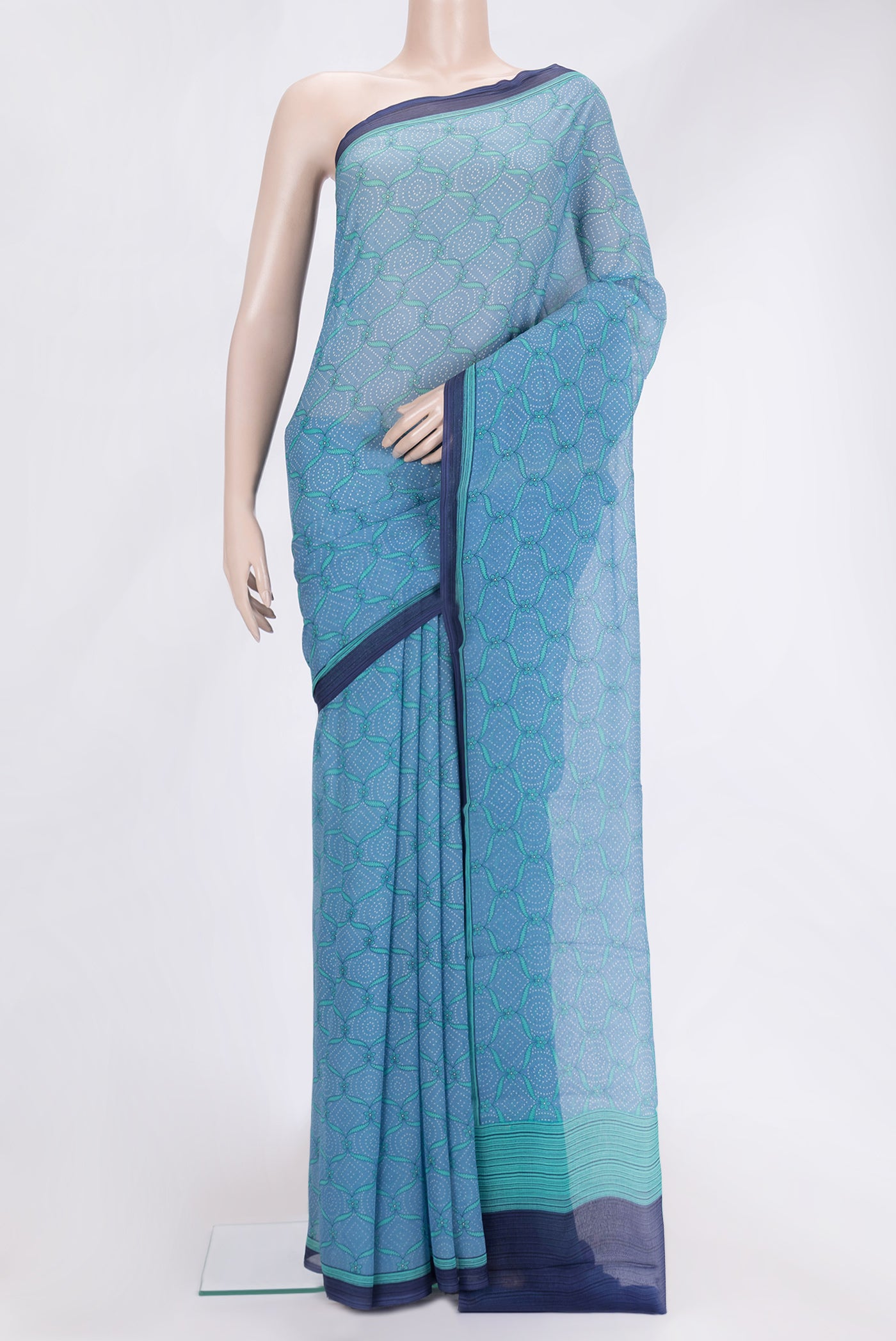Sky Blue Dual Tone Mysore Chiffon Saree with Printed design on the body and Printed Border.  displayed on a mannequin