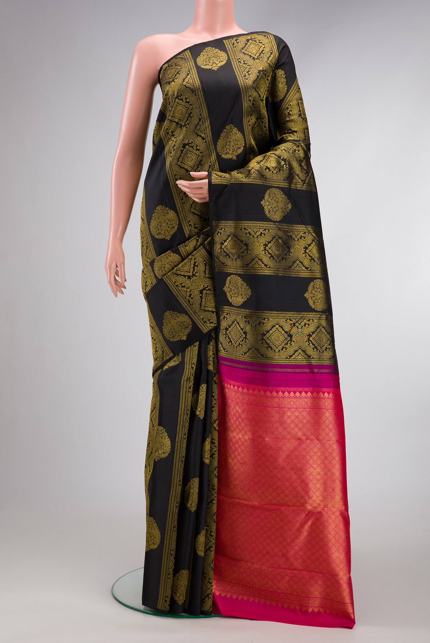 Black Dual Tone Kanjivaram Silk Saree with Zari Butta on the body and Without Border.  displayed on a mannequin
