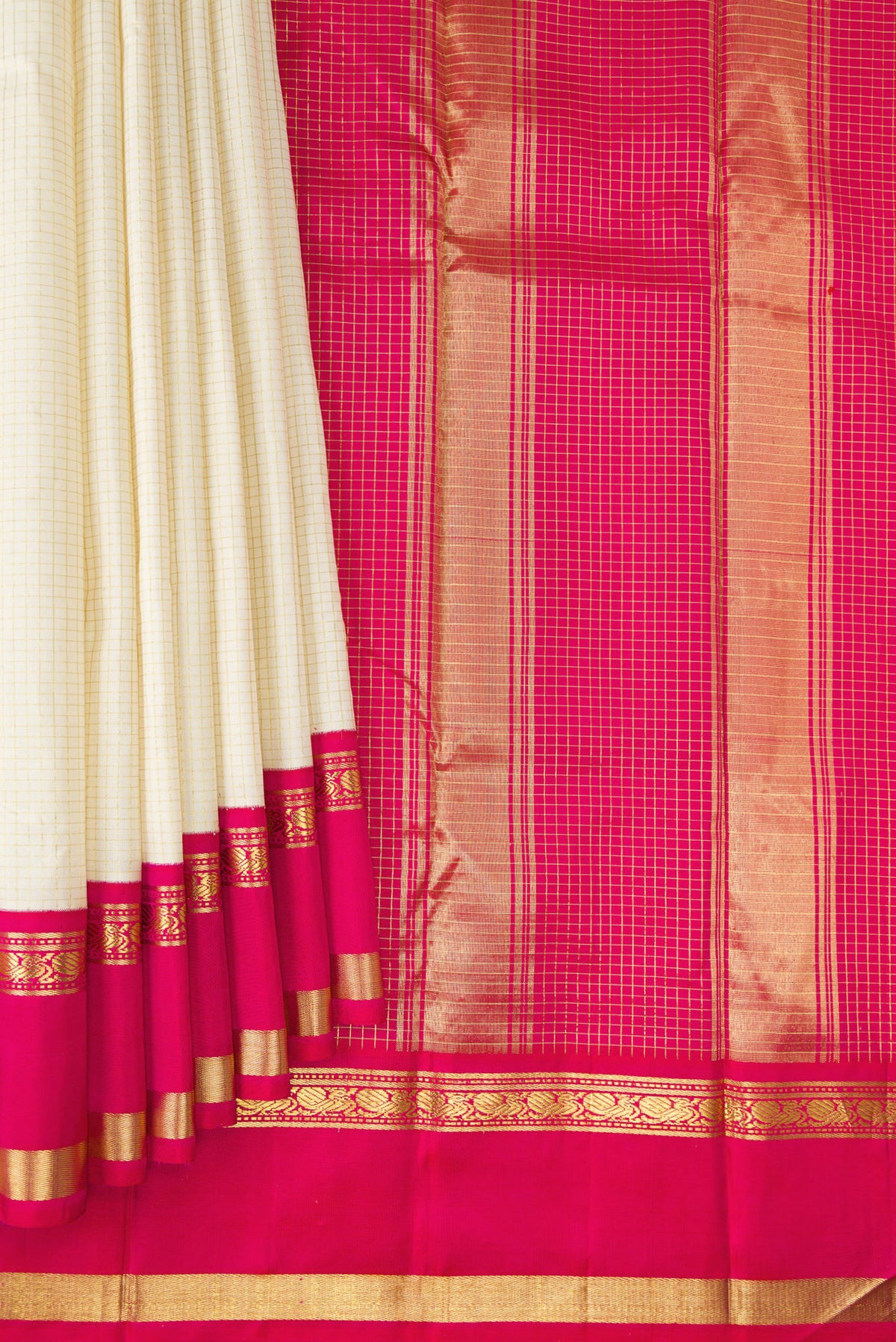 Pleats and pallu of Pure Silk Off White Kanjivaram Saree with Checked design on the body and Zari Border. 