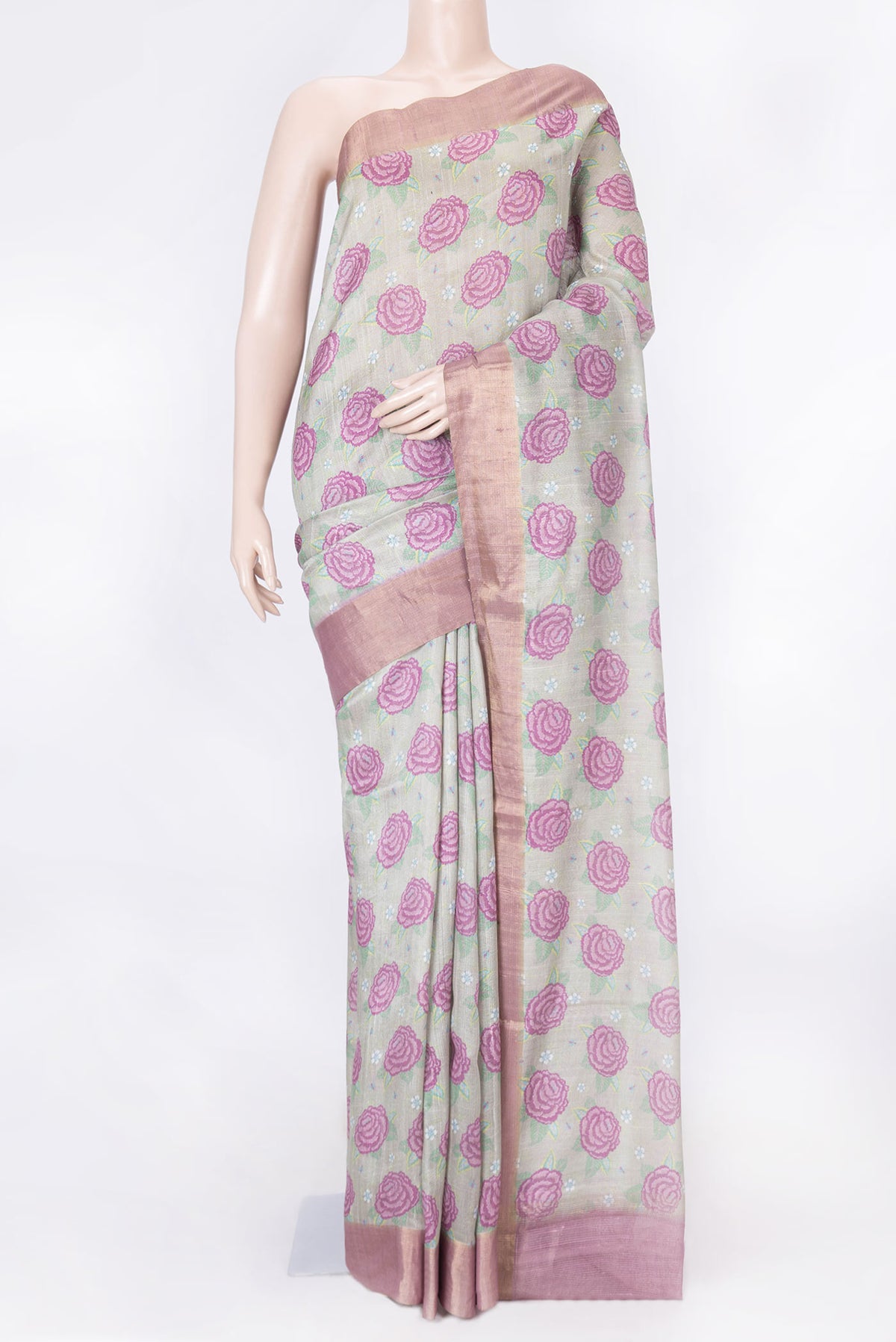 Light Green Dual Tone Tussar Silk Saree with Printed design on the body and Zari Border displayed on a mannequin