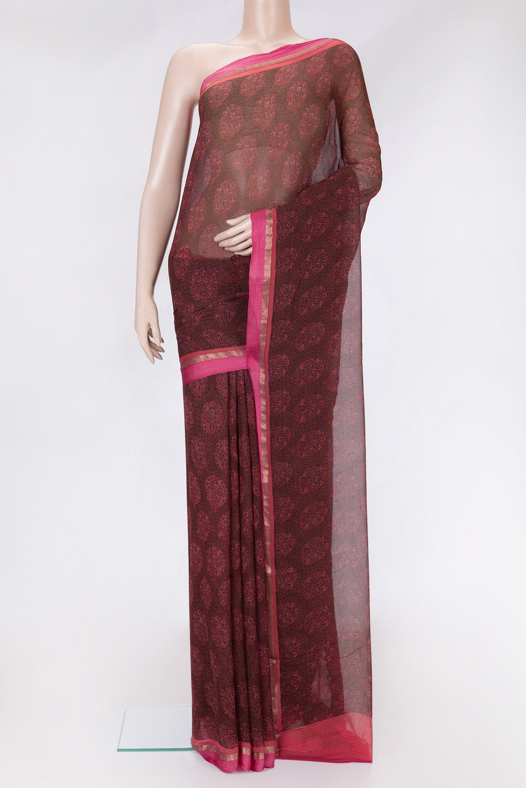 Brown Dual Tone Chiffon Saree with Printed design on the body and Zari Border.  displayed on a mannequin