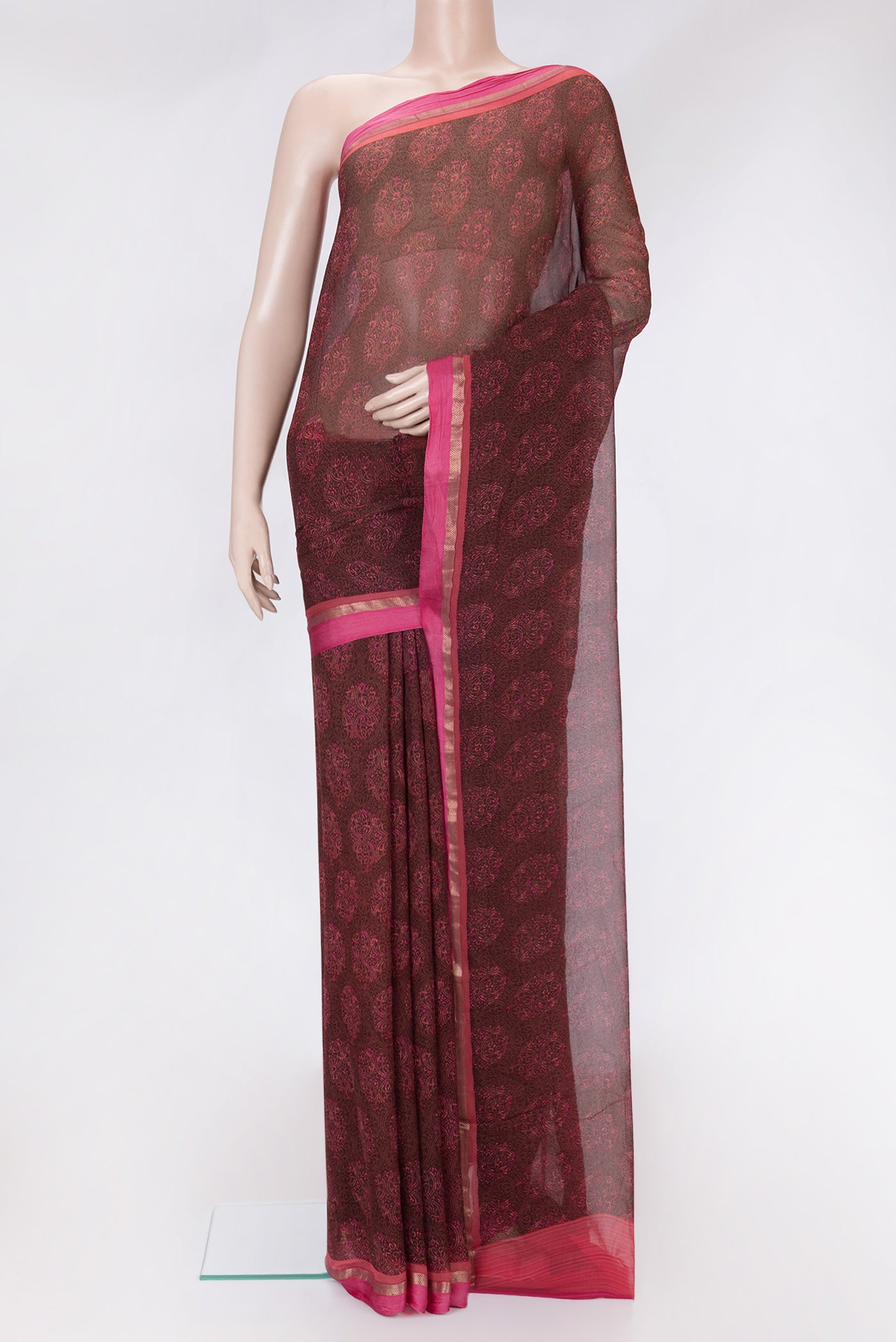 Brown Dual Tone Chiffon Saree with Printed design on the body and Zari Border.  displayed on a mannequin