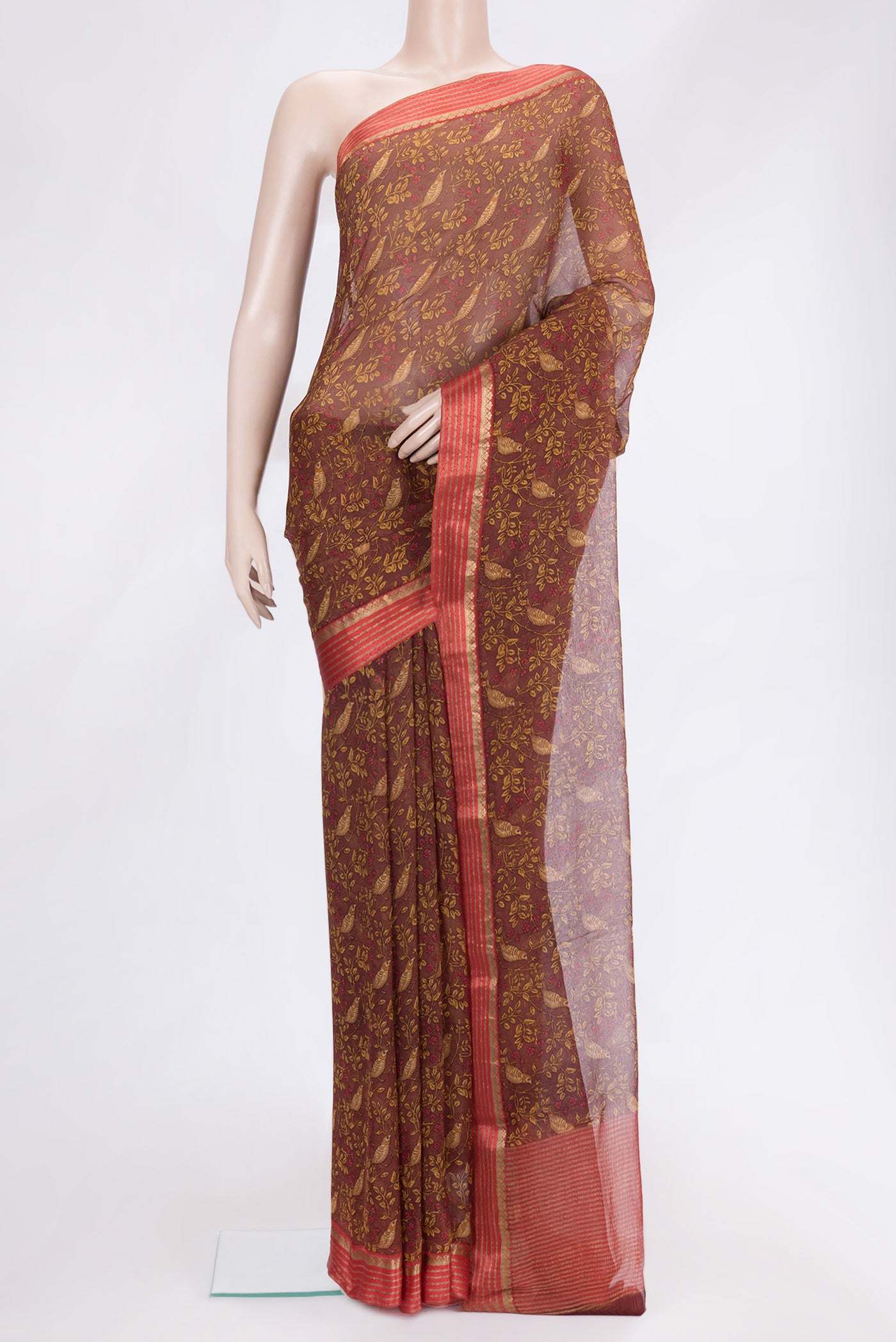 Brown Dual Tone Mysore Chiffon Saree with Printed design on the body and Zari Border.  displayed on a mannequin