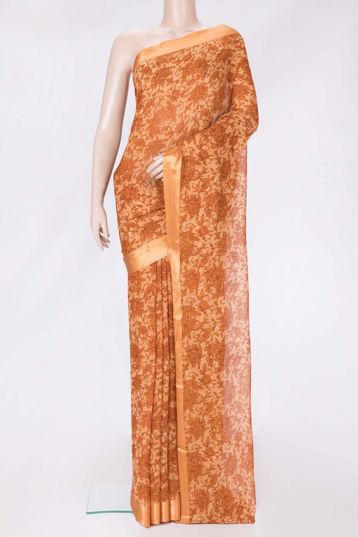 Golden Peach Dual Tone Chiffon Saree with Printed design on the body and Thread Border.  displayed on a mannequin