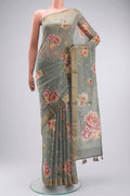 Sage Green Silk Cotton Saree with Printed design on the body and Zari Border displayed on a mannequin